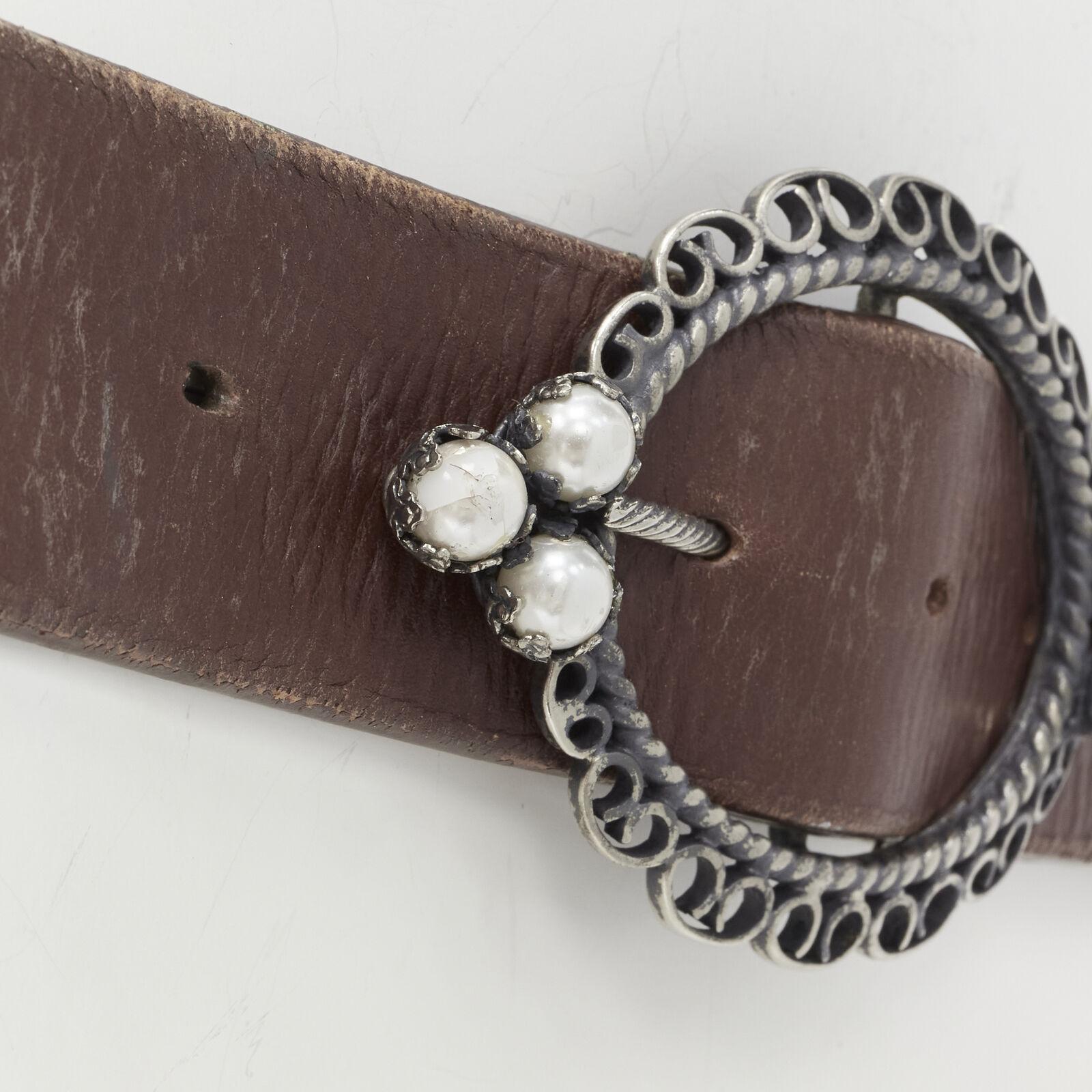 CHRISTIAN DIOR Vintage pearl embellished antique buckle brown cowboy belt
Reference: ANWU/A00856
Brand: Christian Dior
Material: Leather
Color: Brown
Closure: Belt

CONDITION:
Condition: Poor, this item was pre-owned and is in poor condition. Please