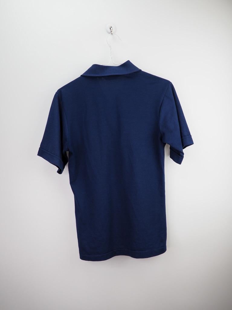 Classic polo by Dior in navy blue, 1/4 button up with logo on the front. 

COLOR: Blue 
MATERIAL: 100% cotton 
SIZE: Small
CONDITION: Great - very clean rarely used shirt.

Made in
