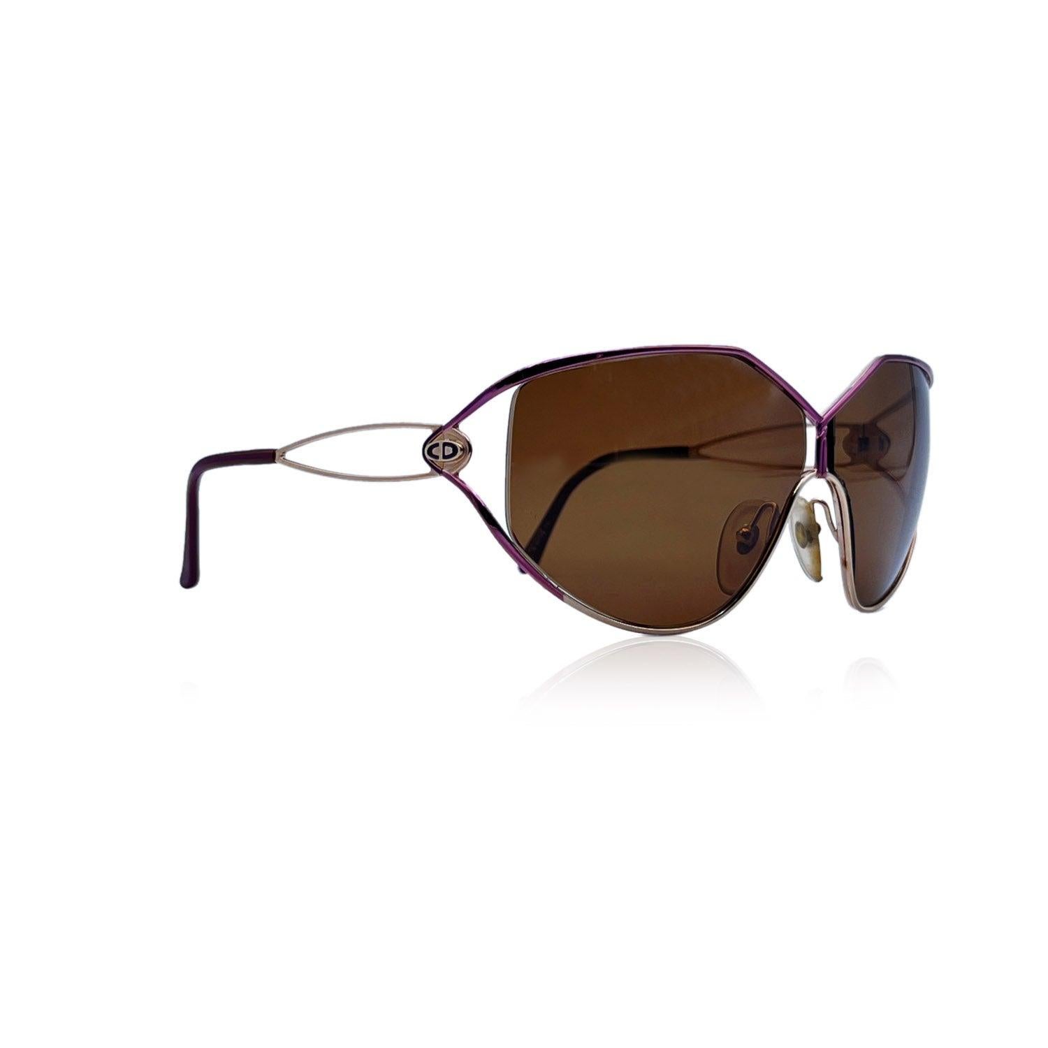 Christian Dior Vintage Sunglasses, Model 2345 - 48 - 64/08 115. Purple and gold metal frame. CD logo on temples. Brown lenses. Made in Austria. Details MATERIAL: Metal COLOR: Purple MODEL: 2345 - 48 GENDER: Women COUNTRY OF MANUFACTURE: Austria