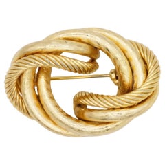 Christian Dior Vintage – Seltene, massive Brosche aus dem Jahr 1964 mit goldenem Seilmotiv, gedrehtem Knoten und Wirbelmuster