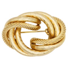 Christian Dior Vintage – Seltene, massive Brosche aus dem Jahr 1964 mit goldenem Seilmotiv, gedrehtem Knoten und Wirbelmuster
