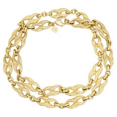 Collar largo vintage de Christian Dior, de oro, con eslabones de filigrana en forma de omega entrelazados, muy exclusivo