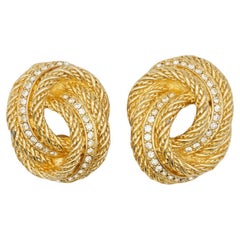 Boucles d'oreilles Christian Dior Vintage : modèle rare en or, avec grand nœud, torsadé, en spirale, en forme de corde et ornées de cristaux