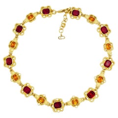 Collier Christian Dior vintage : fleurs ajourées en cristal, rubis, citrine et topaze