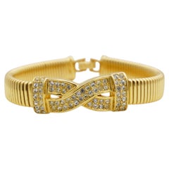 Bracciale Omega vintage Christian Dior, raro, unisex, con croce in cristalli dorati e struttura a coste