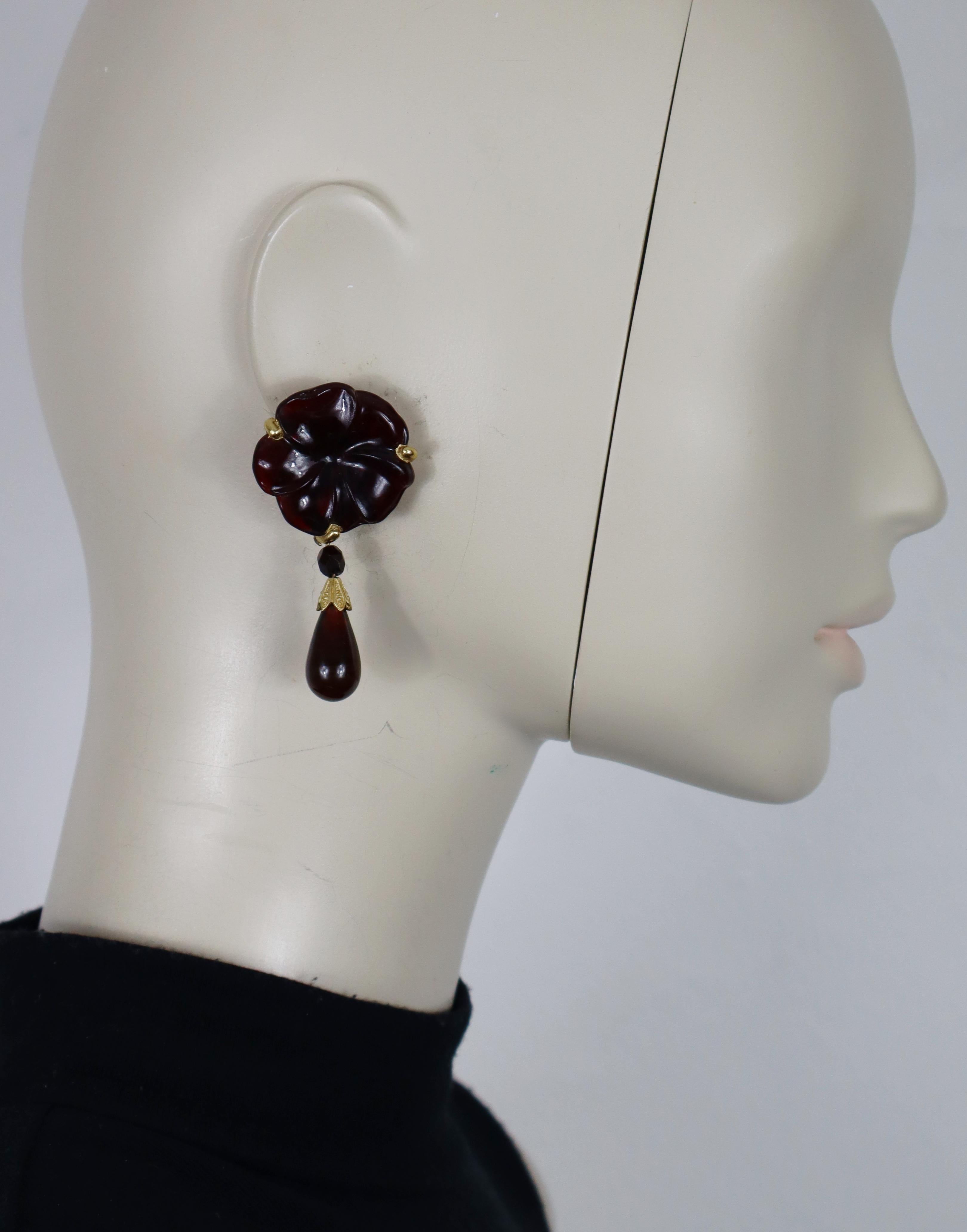 CHRISTIAN DIOR vintage dangling earrings (clip-on) featuring a red glass flower with a red glass tear drop in a gold tone setting.

Embossed CHR. DIOR Germany.

Indicative measurements : max. height approx. 6.5 cm (2.56 inches) / max. width approx.