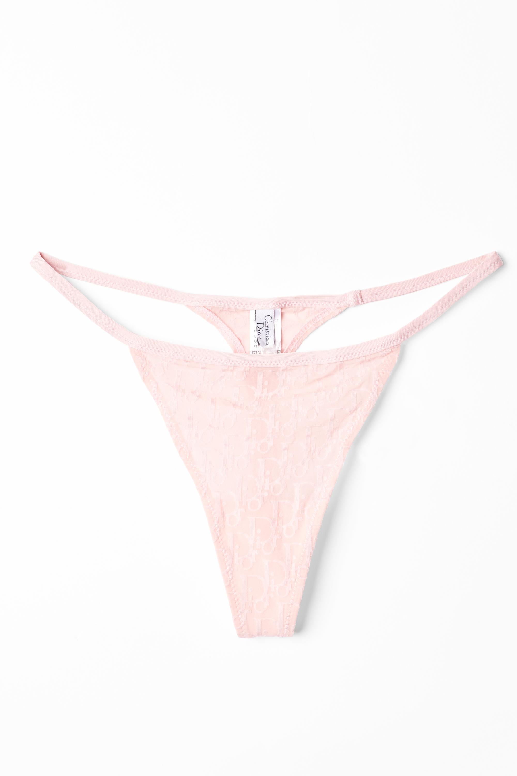 Christian Dior S/S 2003 pink mesh thong panty adorned with the Dior Monogram logo all over, designed by John Galliano for Dior . 
Authenticity Guaranteed.  In excellent condition, brand new with tags.

Tag Size: FR40
Modern Size: UK:8 , US:4 ,
