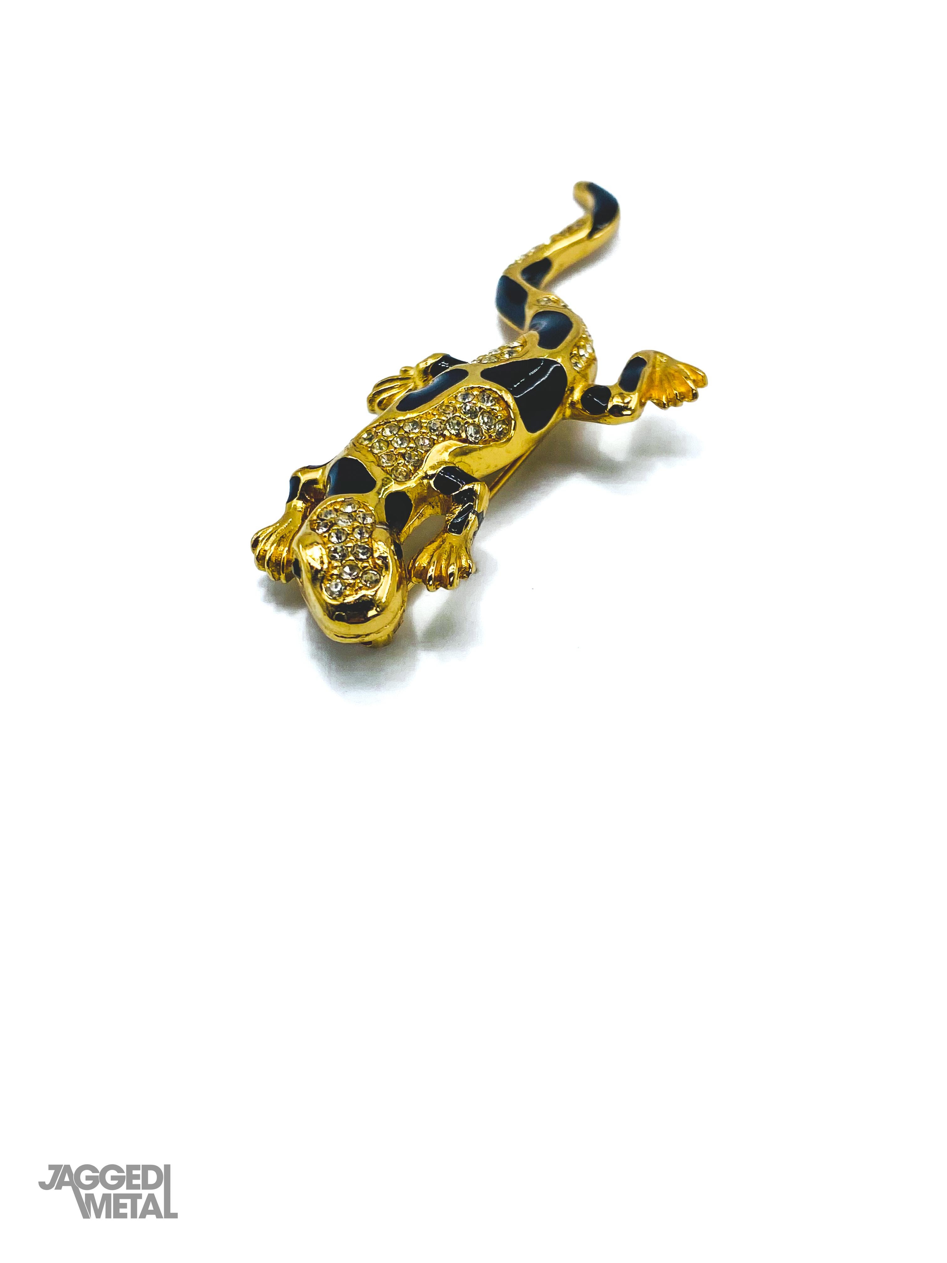 Christian Dior Vintage 1970s Salamander Brooch

Timelessly cool statement brooch - classic 80s Dior! 

Detail
-Made in Germany in 1970
-Crafted from gold plated metal, black enamel and Swarovski crystals

 Size & Fit
-Measures approx 1 1/4