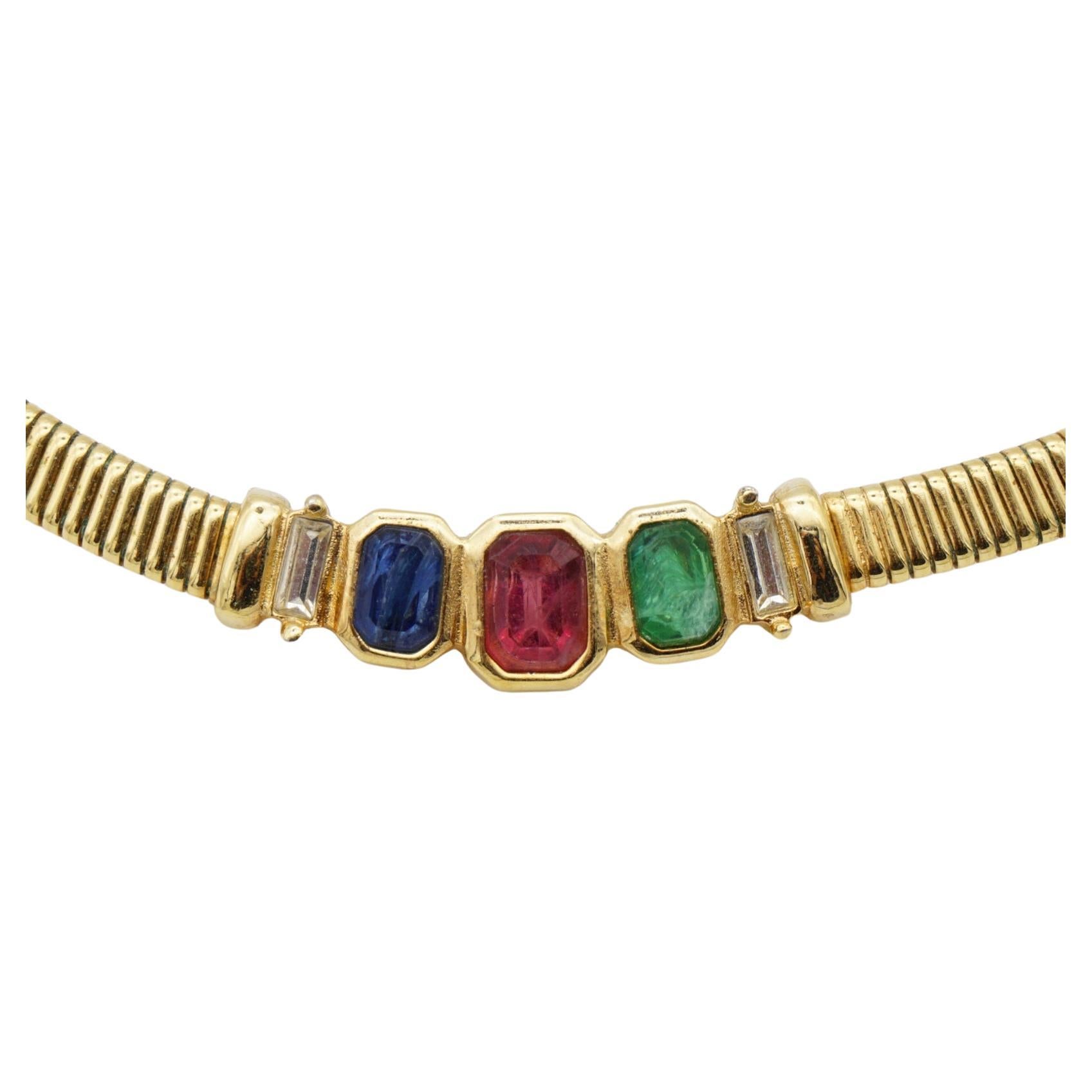 Christian Dior Vintage 1980s Gripoix Sapphire Emerald Ruby Blue Navy Green Red Octagon Rectangle Crystals Omega adjustable Ribbed Omega Choker Necklace, Gold Tone

Very excellent condition. 100% Genuine. Vary rare to find.

A unique piece. Signed at