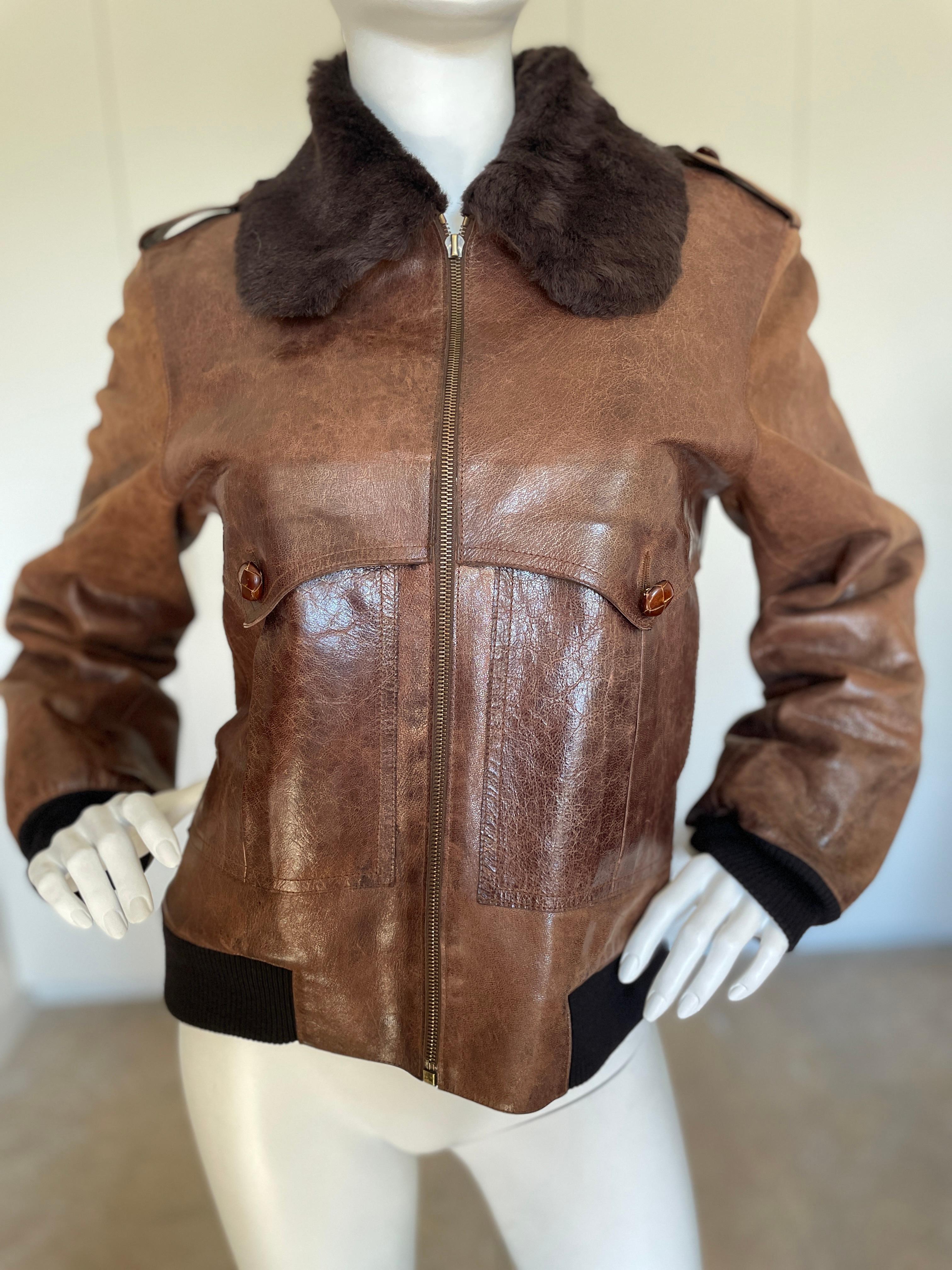 Christian Dior Vintage Unisex Shearling Lined Leather Aviator Jacket.
I think it is Galliano era. Its roomy enough for a small guy.
Please use the zoom feature to see details.
 Size 40
Bust 40