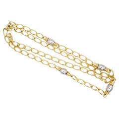 Christian Dior, collier long vintage en argent avec boules Figaro ovales emboîtées entrelacées