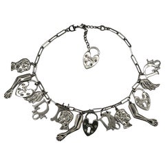 CHRISTIAN DIOR Vintage Silver Tone Figural Charm Necklace