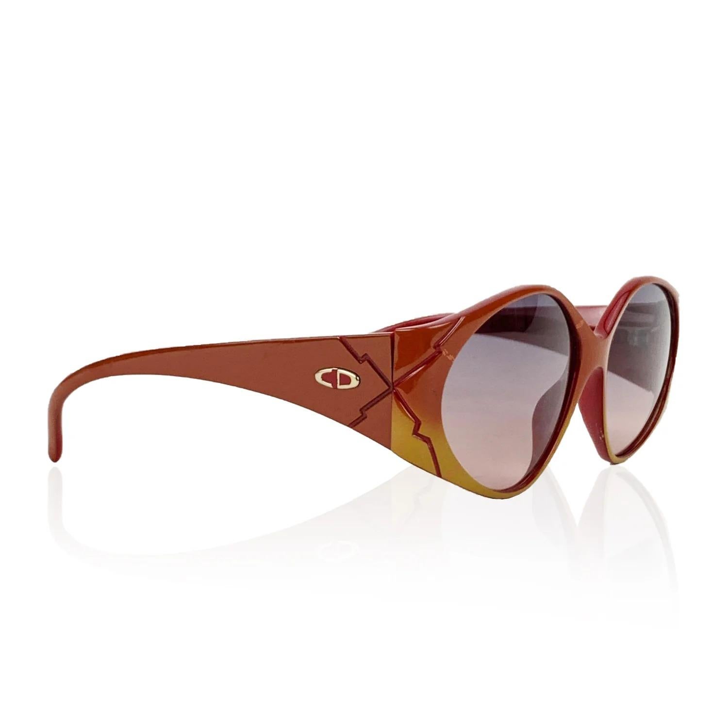 Vintage sunglasses by CHRISTIAN DIOR, mod. 2348 - 10. Bicolor red and brown OPTYL frame. CD logo on temple. Gradient brown 100% UV protection lenses. Made in Germany. Details MATERIAL: Acetate COLOR: Red MODEL: 2348 GENDER: Women COUNTRY OF
