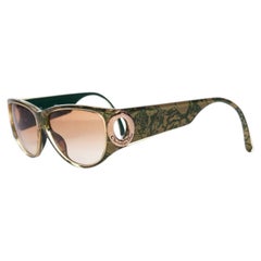 Christian Dior, Vintage sunglasses in green and gold.