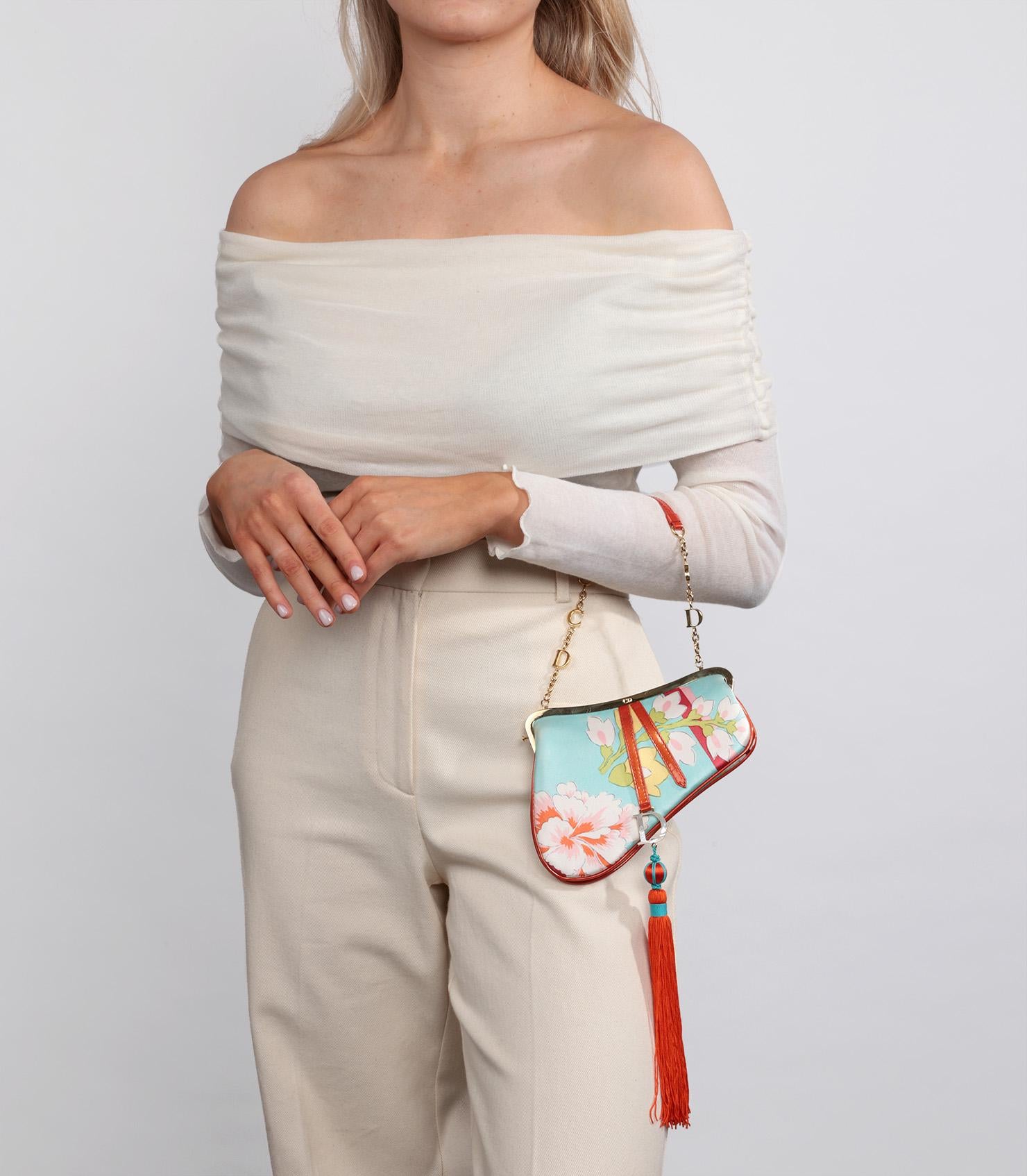 Christian Dior Light Blue Floral Silk & Red Patent Leather Vintage Tassel Mini Saddle Bag

Product Details
Xupes Ref: CB1196
Brand: Christian Dior
Model:  Mini Saddle Bag
Type: Top Handle
Serial Number: 19BM-0073
Age: 2003
Accompanied By: Christian