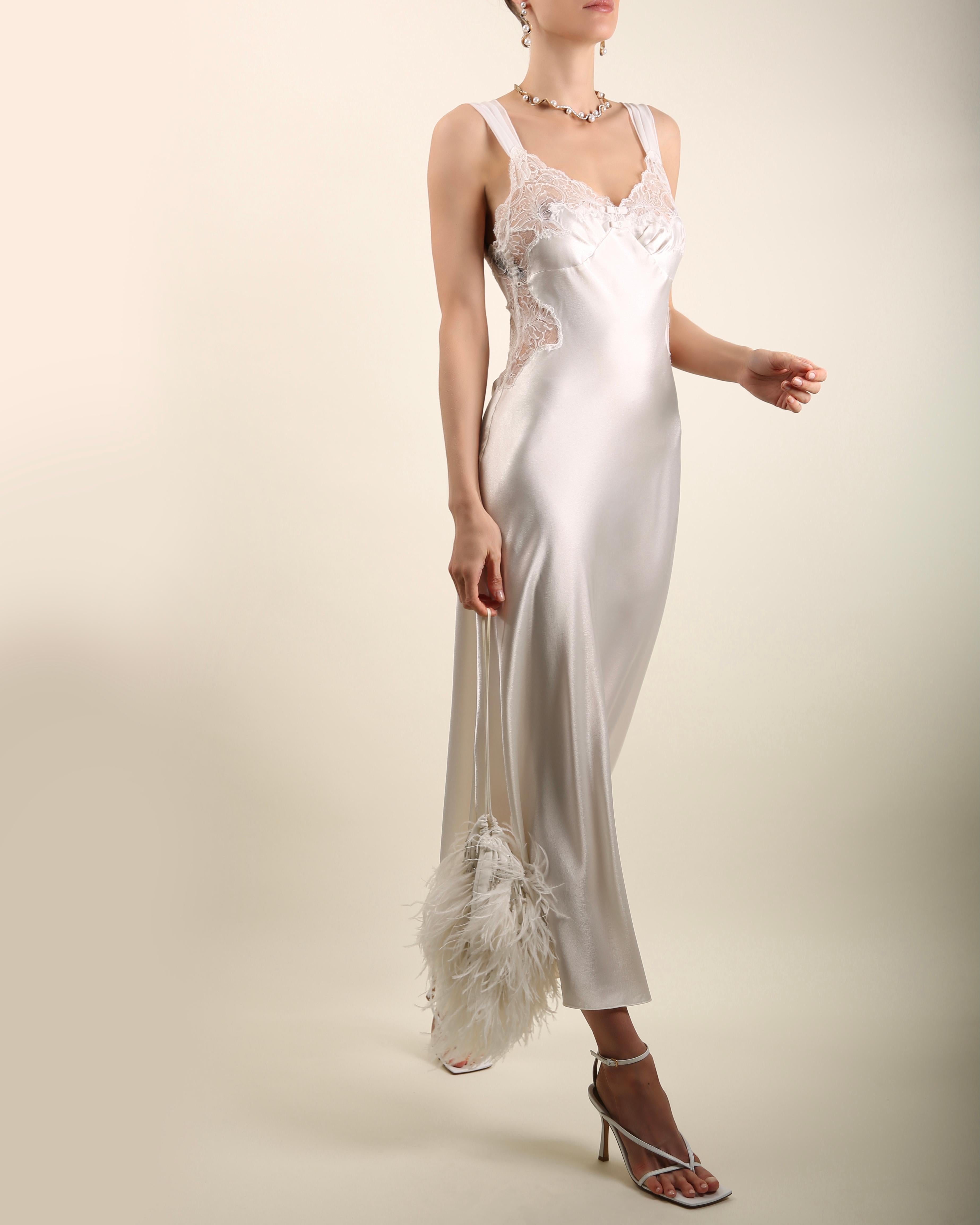A beautiful vintage nightgown by Christian Dior in ivory satin which can easily be worn as a slip dress in an evening teamed with a pair of high heels
Midi length
Body skimming fit
Sheer lace detail to the bust and sides with slightly sheer wide