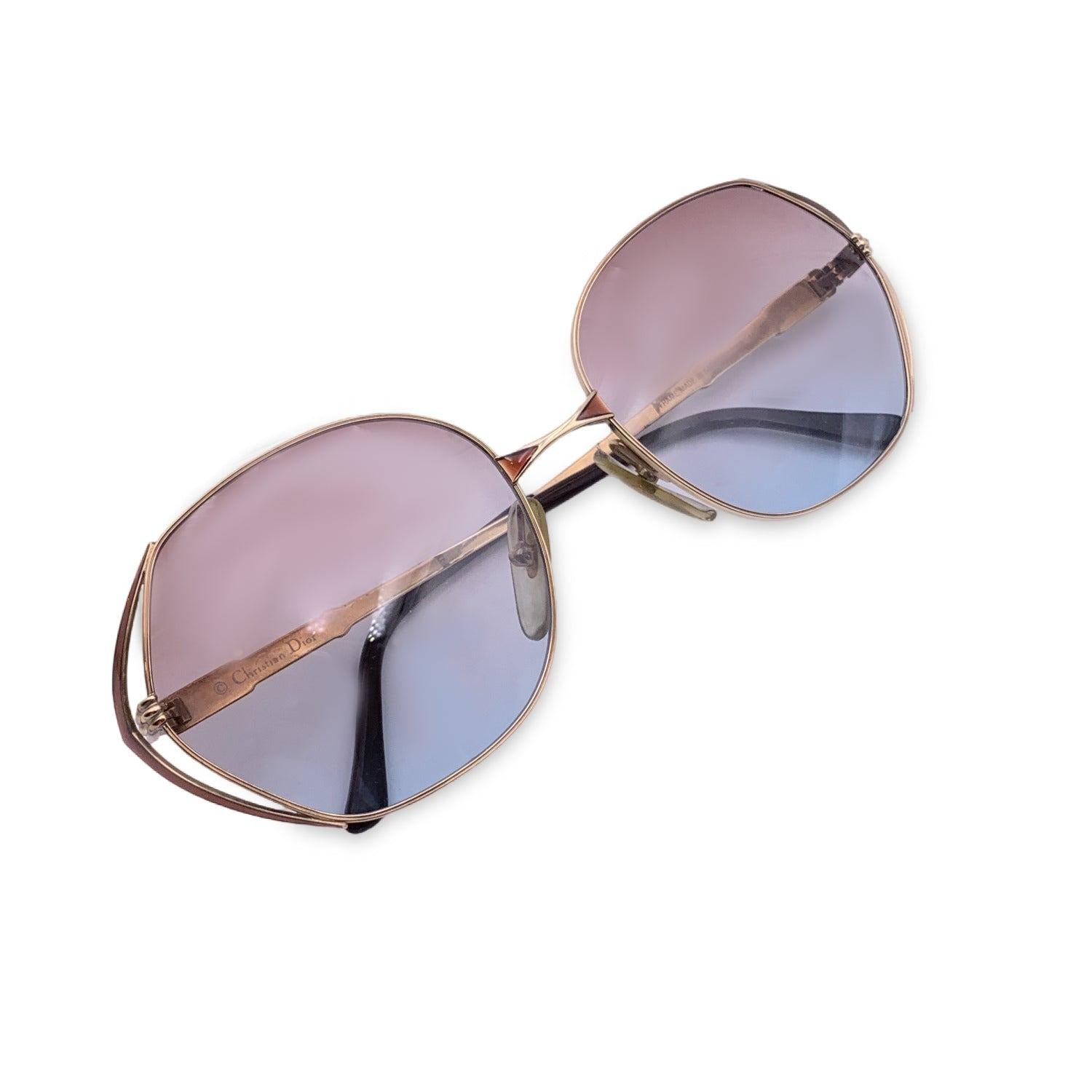 Vintage Christian Dior Women Sunglasses, Mod. 2302 41. Size: 56/17 125mm. Gold metal frame, with brown gold geometrical triangles at the side of the frame. Gold CD logo con temples . 100% Total UVA/UVB protection. From brown to light blue gradient