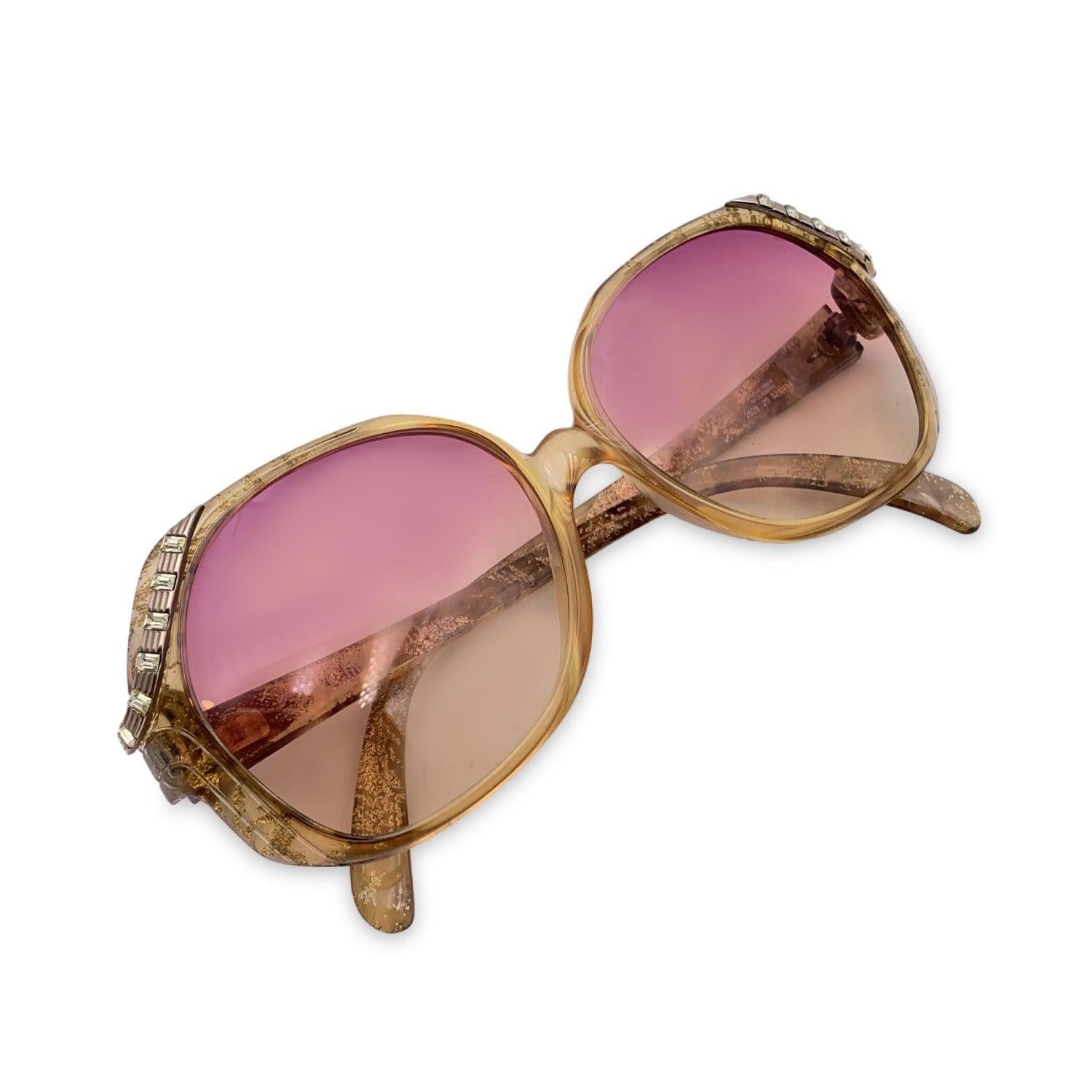 Vintage Christian Dior Women Sunglasses, Mod. 2528 20 Optyl. Size: 52/14 125mm. Beige acetate square frame with gold details on the upper side of the frame. CD logo on temples . 100% Total UVA/UVB protection. Pink gradient lenses. Details MATERIAL: