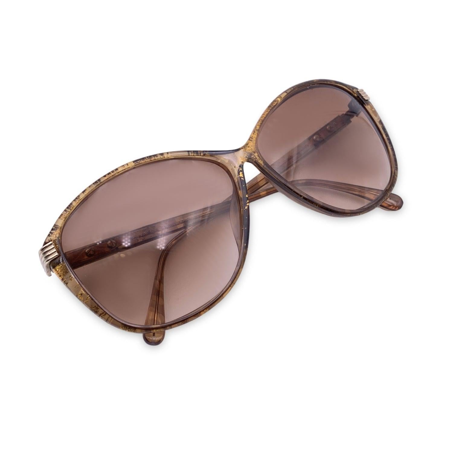 Vintage Christian Dior Women Sunglasses, Mod. 2531 31 Optyl. Size: 58/11 135mm. Brown with gold details acetate Optyl frame. 100% Total UVA/UVB protection brown gradient lenses. CD logos on gold metal finish placed on the side of the temples.