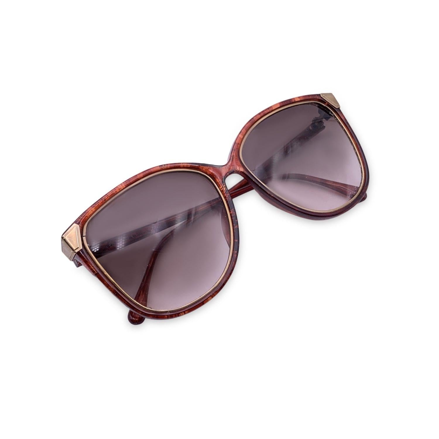 Vintage Christian Dior Women Sunglasses, Mod. 2546 30 Optyl. Size: 54/13 130mm. Reddish brown acetate frame with gold CD logo on temples . 100% Total UVA/UVB protection. Brown gradient lenses. Details MATERIAL: Plastic COLOR: Brown MODEL: 2546