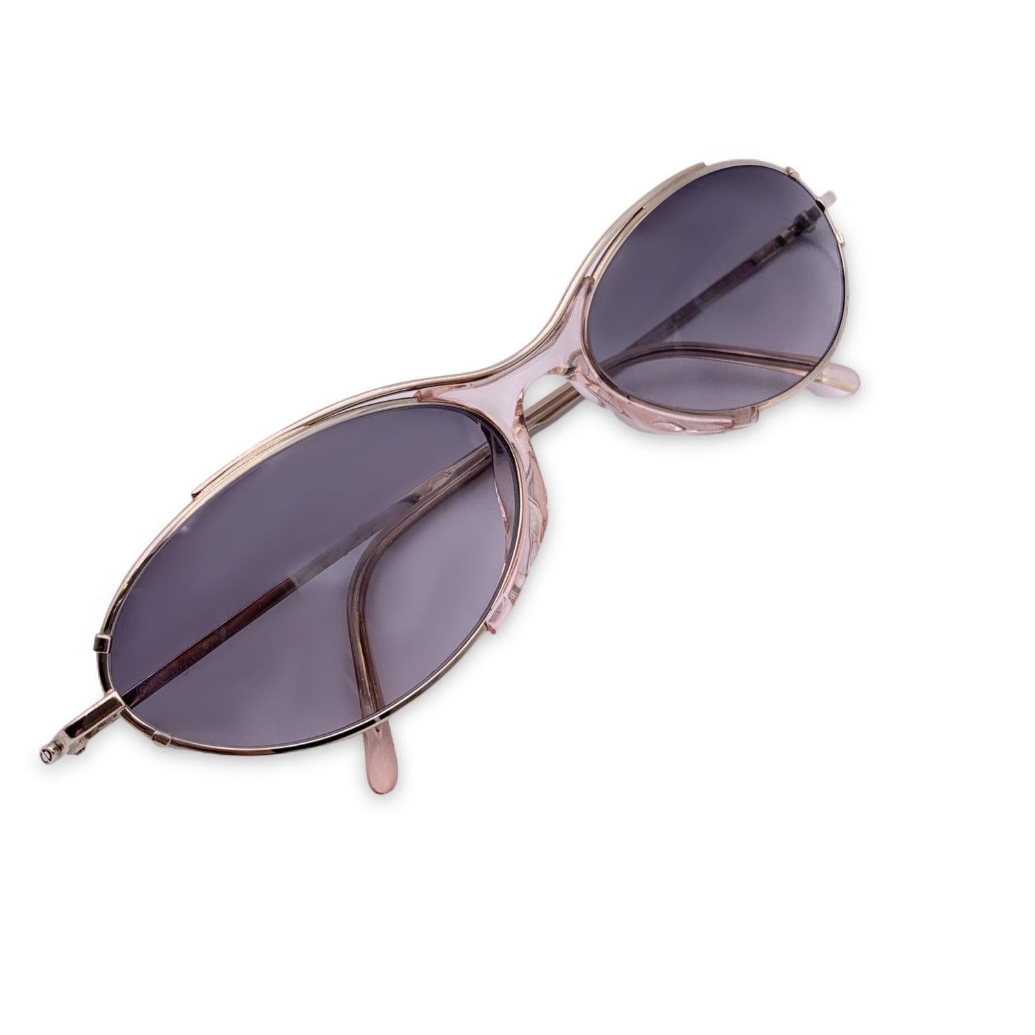 Vintage Christian Dior Women Sunglasses, Mod. 2551 40. Size: 58/18 130mm. Silver metal frame, with a transparent pink detail on the bridge. CD logo on silver temples. 100% Total UVA/UVB protection. Grey gradient lenses. Details MATERIAL: Metal