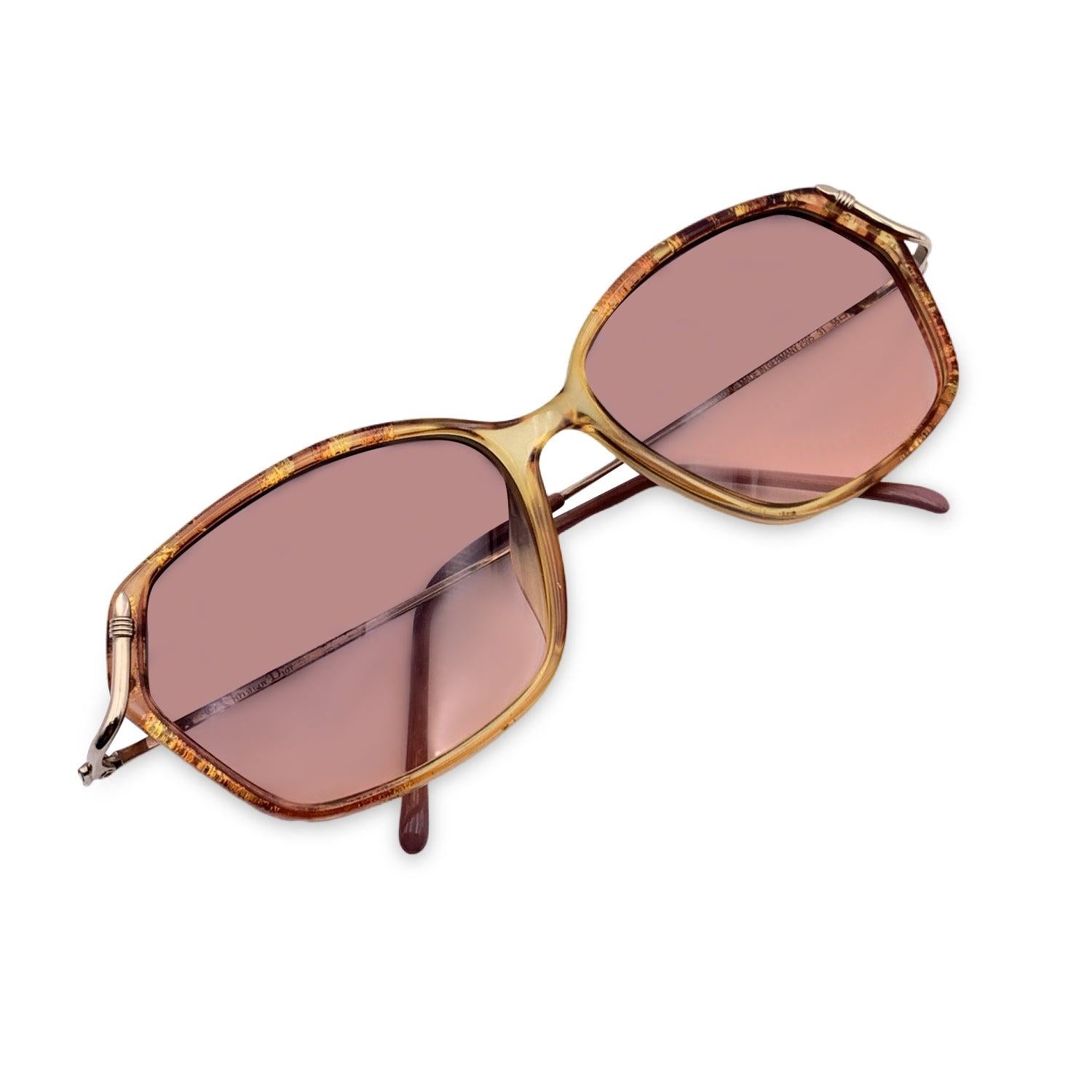Vintage Christian Dior Sunglasses, Mod. 2595 31 - 55/15 - 125mm. Brownish semi transparent Opyl Frame with gold metal arms. Original 100% Total UVA/UVB protection in gradient lenses. CD logo on temples. Details MATERIAL: Plastic COLOR: Brown MODEL: