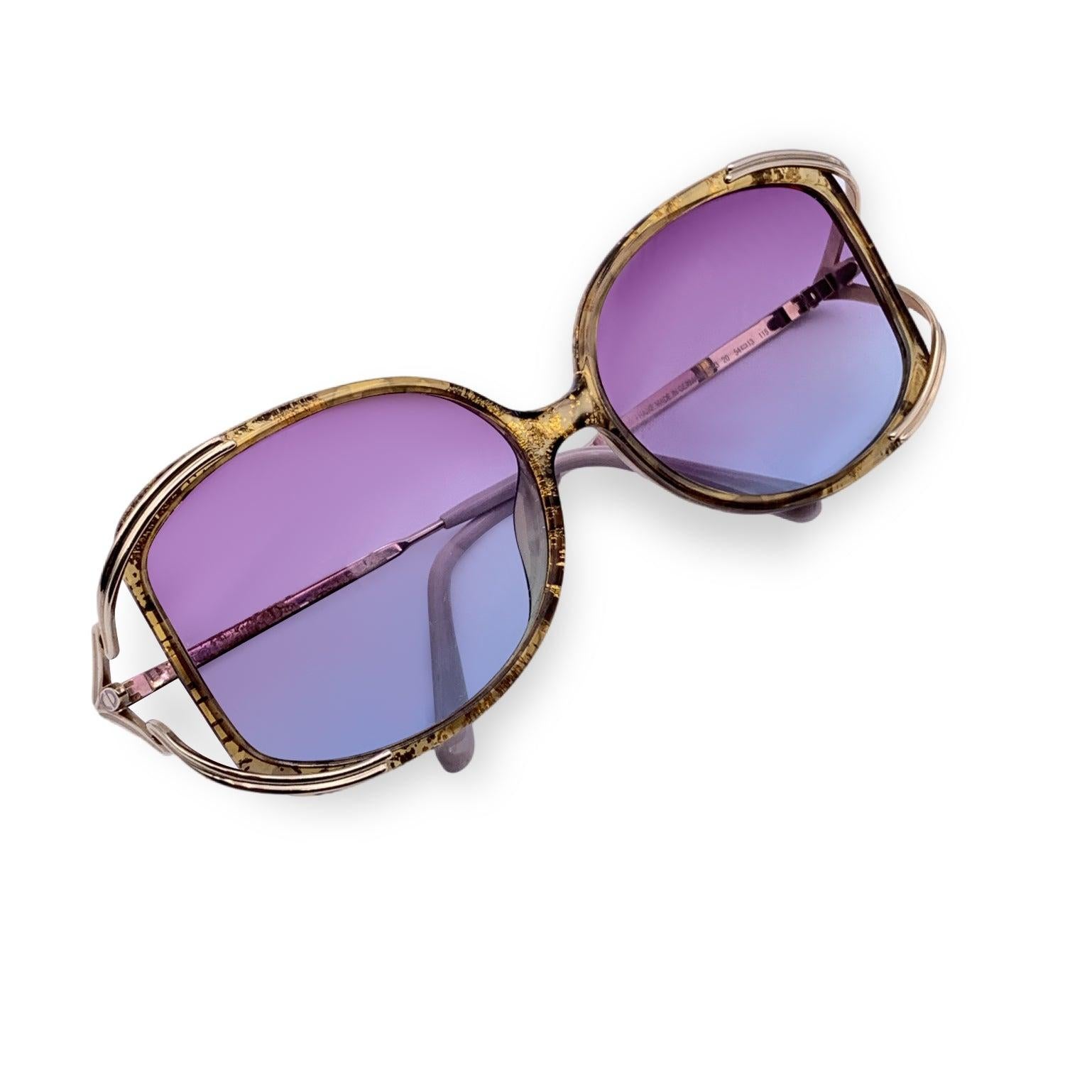 Vintage Christian Dior Women Sunglasses, Mod. 2643 20 - 54/13 115mm. Gold metal frame. 100% Total UVA/UVB protection bi-color purple gradient lenses. CD logos on the side of the temples. Details MATERIAL: Metal COLOR: Gold MODEL: 2643 GENDER: Women