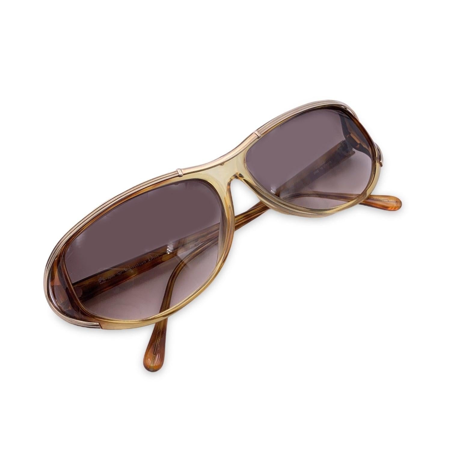 Vintage Christian Dior Women Sunglasses, Mod. 2699 10 Optyl. Size: 57/13 130mm. Beige acetate frame, with a gold detail on the upper frame. CD logo con temples . 100% Total UVA/UVB protection. Brown gradient lenses. Details MATERIAL: Plastic COLOR:
