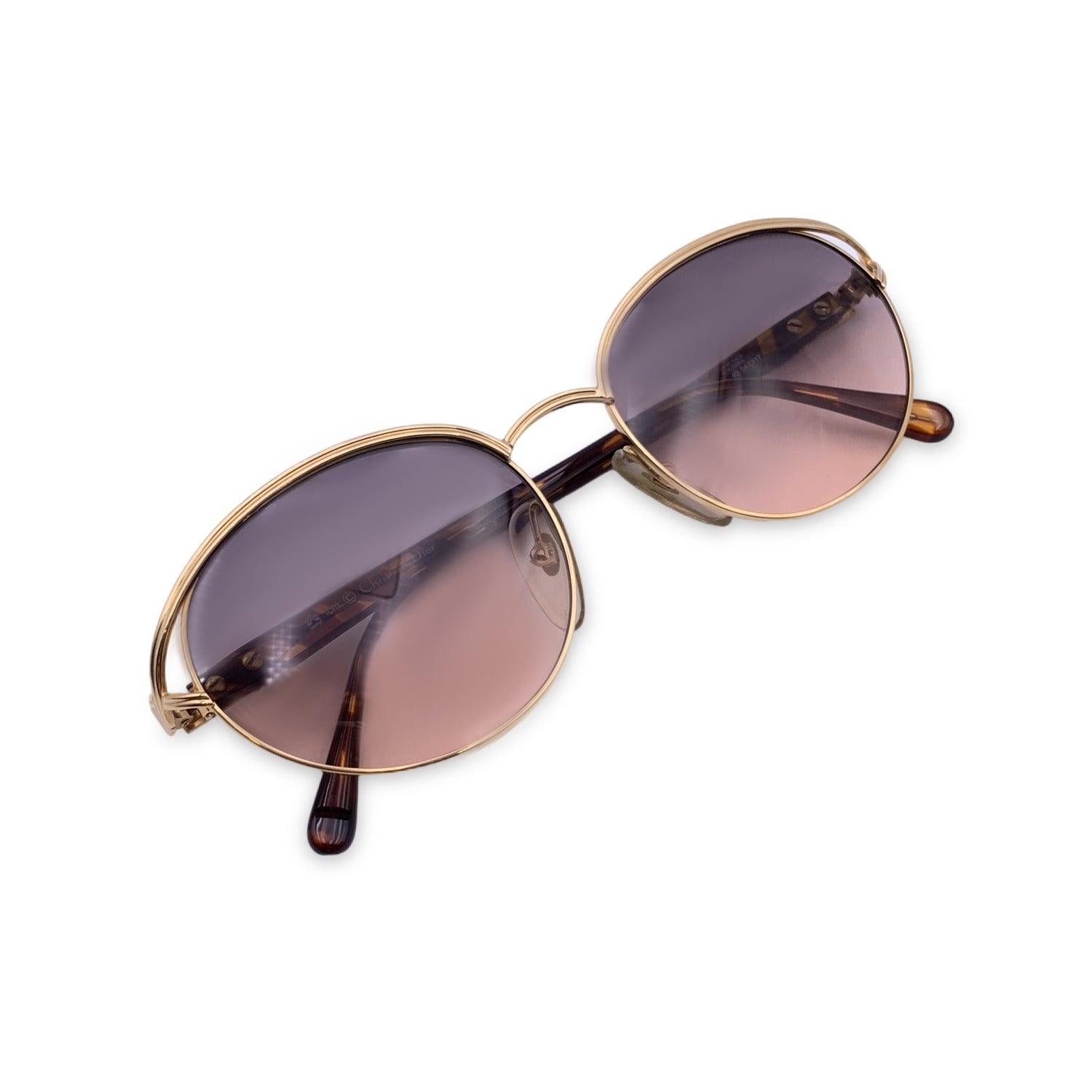 Vintage Christian Dior Women Sunglasses, Mod. 2706 40 Optyl. Size: 54/17 135mm. Gold frame, with brown acetate finish on the sides. CD logo con temples . 100% Total UVA/UVB protection. Pink gradient lenses. Details MATERIAL: Metal COLOR: Gold MODEL: