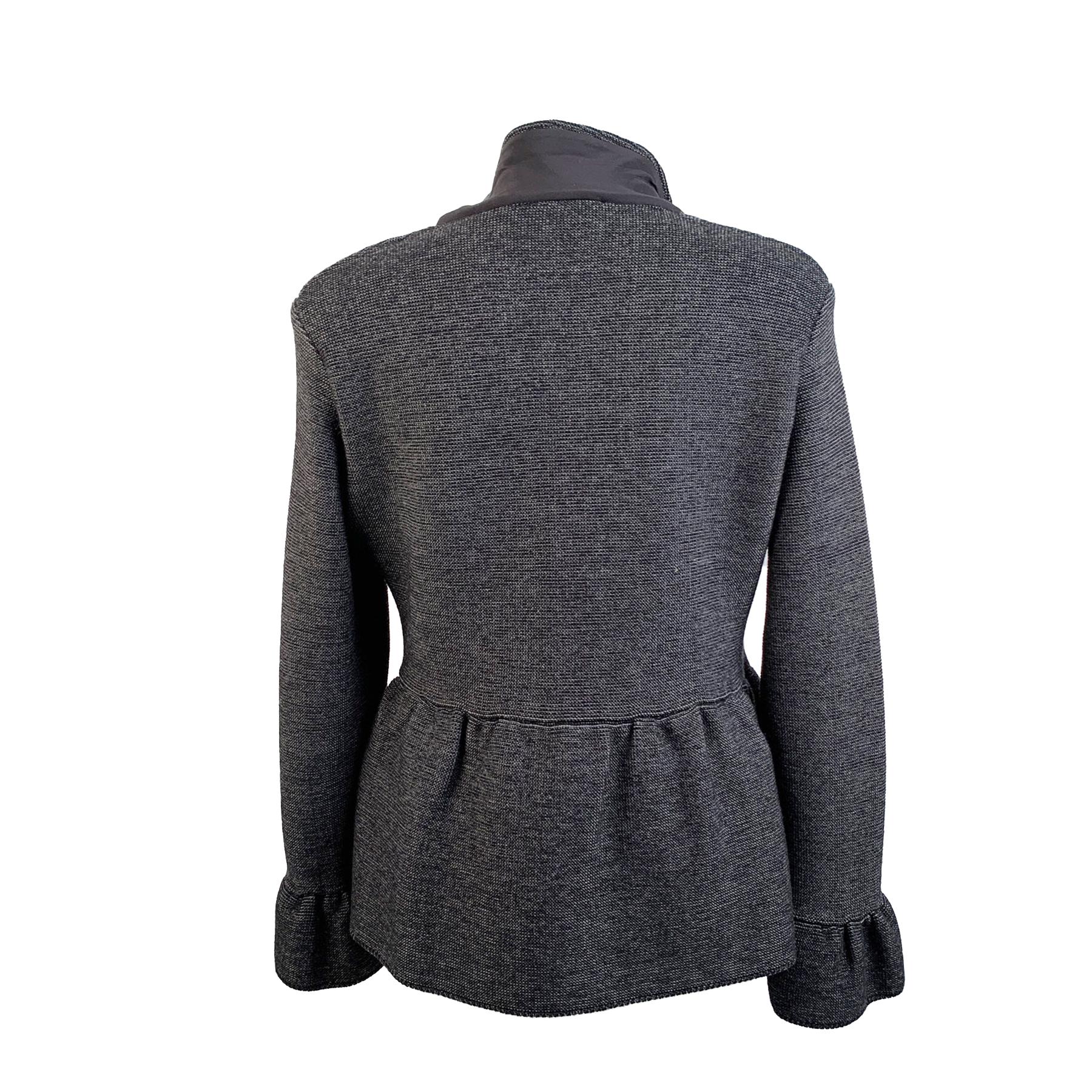 Christian Dior vintage gray cardigan with peplum hem. Shirt collar. Button closure on the front. Composition: 100% Wool. Unlined. Made in Italy. Size: 40 F, 12 GB, 44 IT, 38 D, 8 USA (The size shown for this item is the size indicated by the