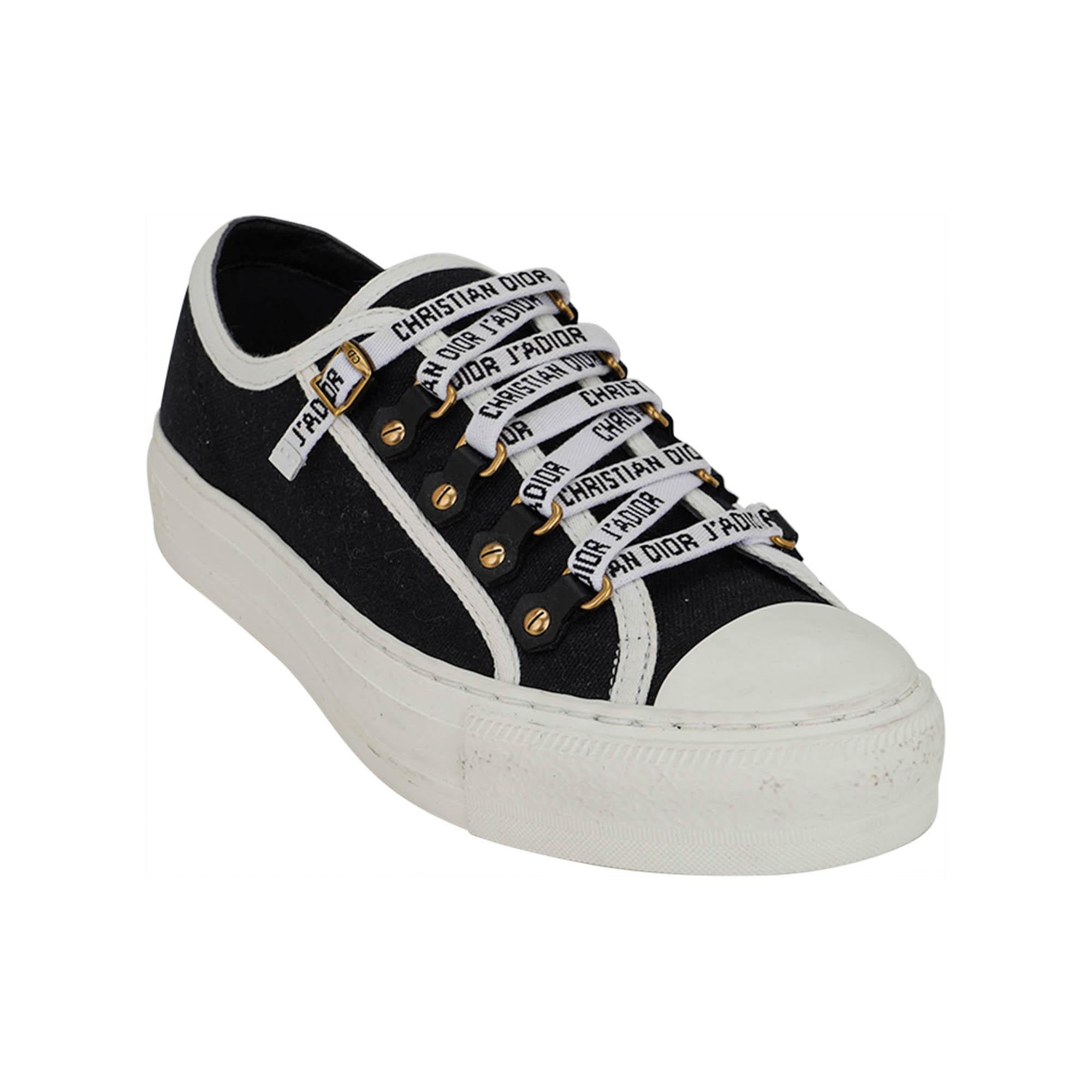 Mightychic offers a pair of Christian Dior J'Adore Walk'n Dior Sneaker featured in Black.
Sneaker has white trim.
The canvas sneaker has lace up closure.
Logo embossed laces.
White Christian Dior J'Adior logo along rear.
White outer sole with Black