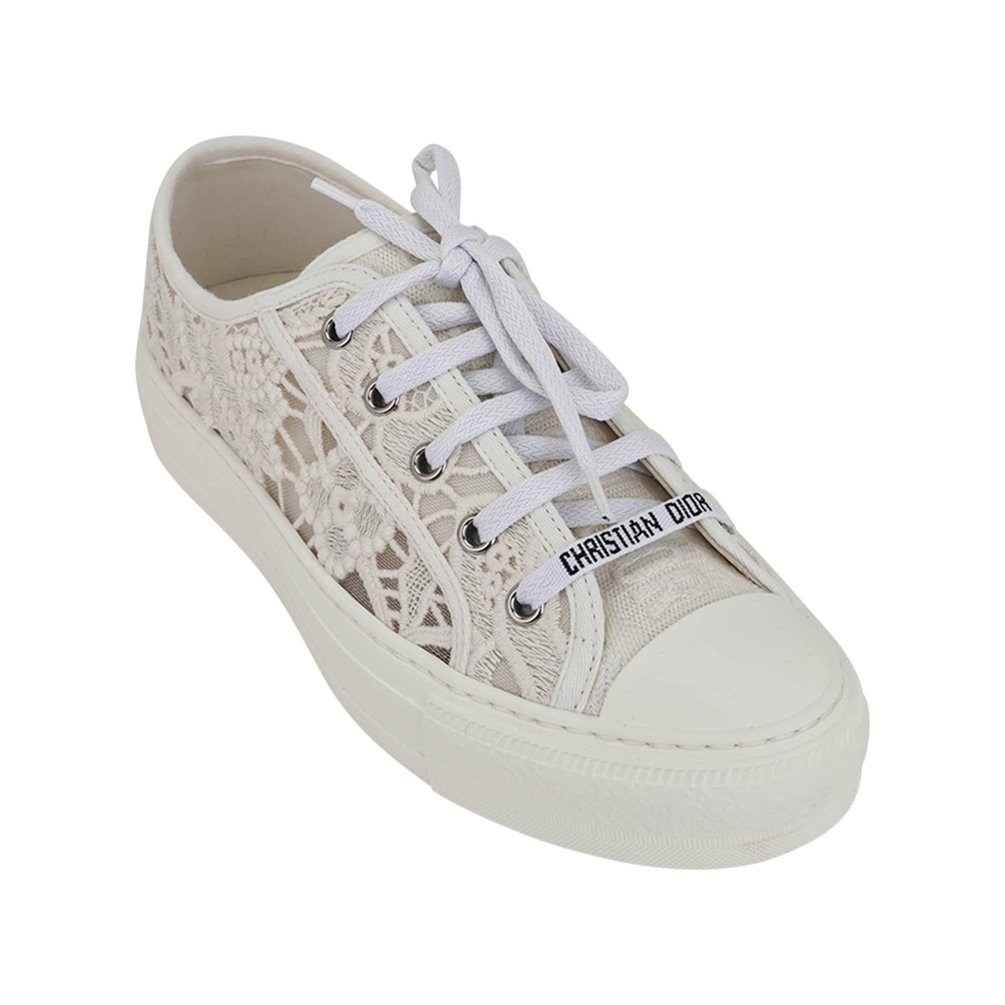 Mightychic offers a pair of Christian Dior Walk'n Dior Macrame sneakers featured in  neutral Ivory.
This versatile feminine sneaker is created in tone on tone pretty flowers.
Rubber soles have Christian Dior embossed on heel.
The soles have the