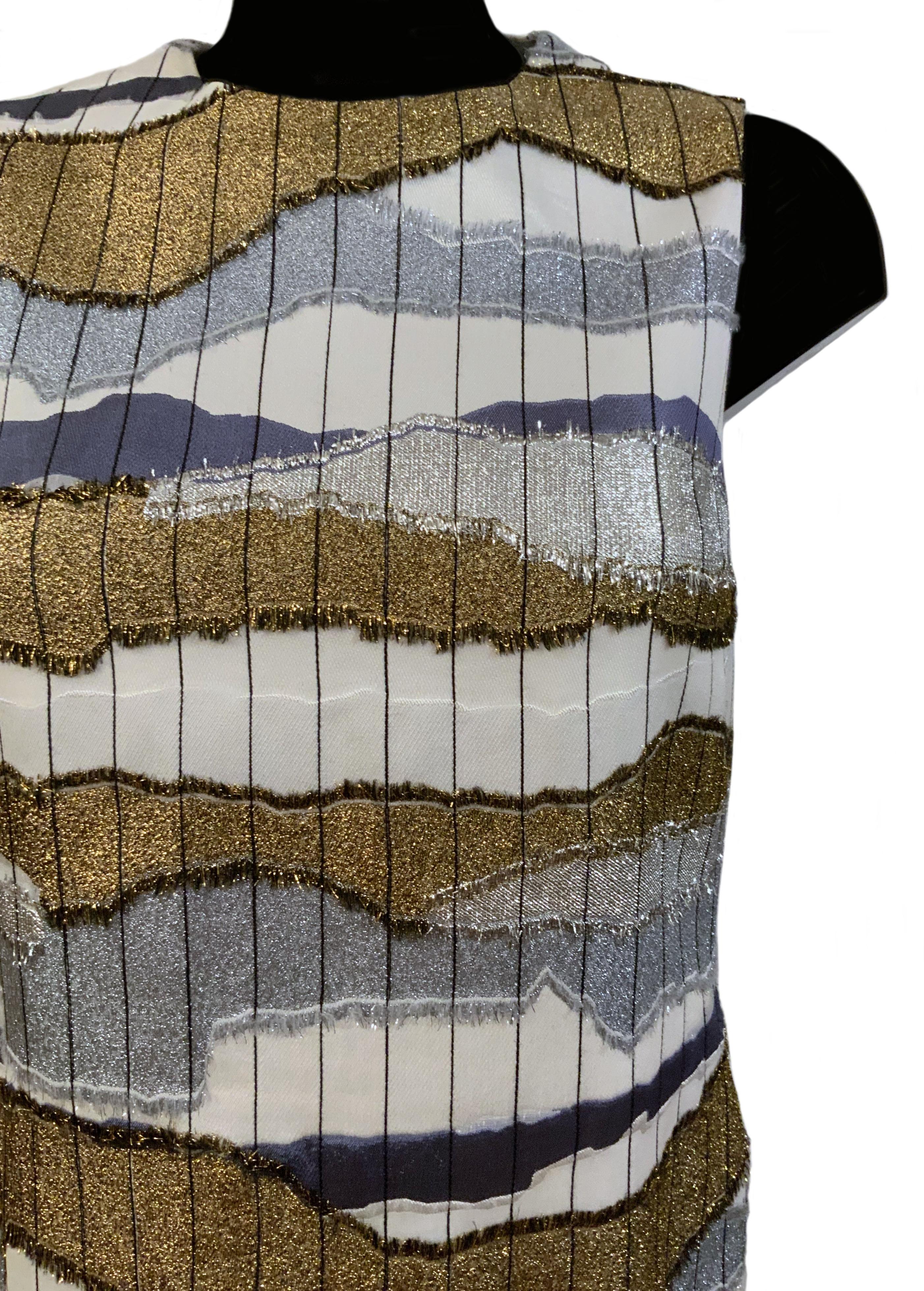 This beautiful pre-owned top from Christian Dior features a metallic multicolor horizontal wave like pattern and a round neckline.

Fabric: 40% viscose, 31% cotton, 14% silk, 8% cupro, 5% polyester, 2% wool
Lining: 100% silk
Color: white, silver,