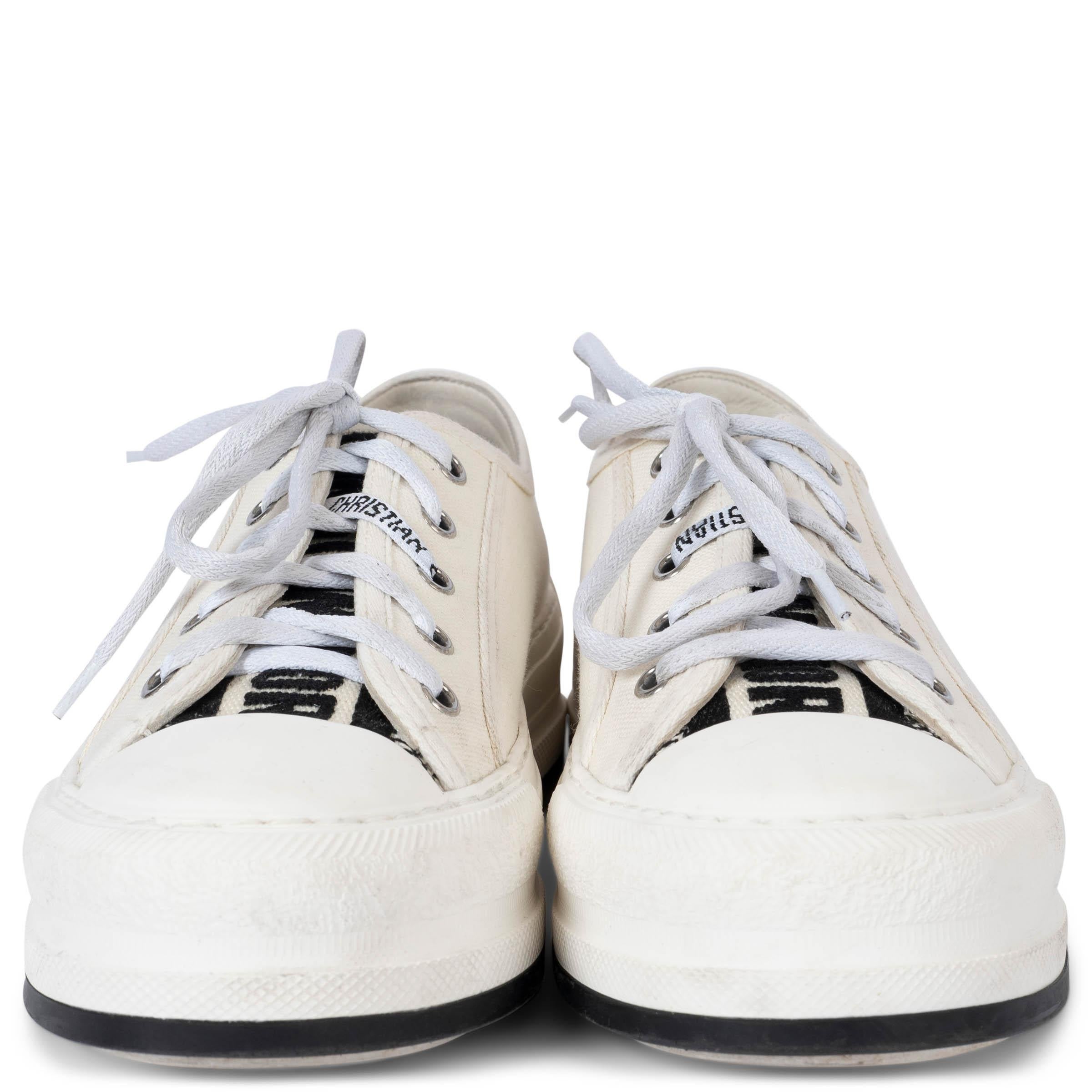 100% authentic Christian Dior Walk'n'Dior platform sneakers in white canvas with black and white embroidered tongue and Christian Dior laces. These shoes come with a pair of extra laces. Have been worn and show some very faint marks on the canvas