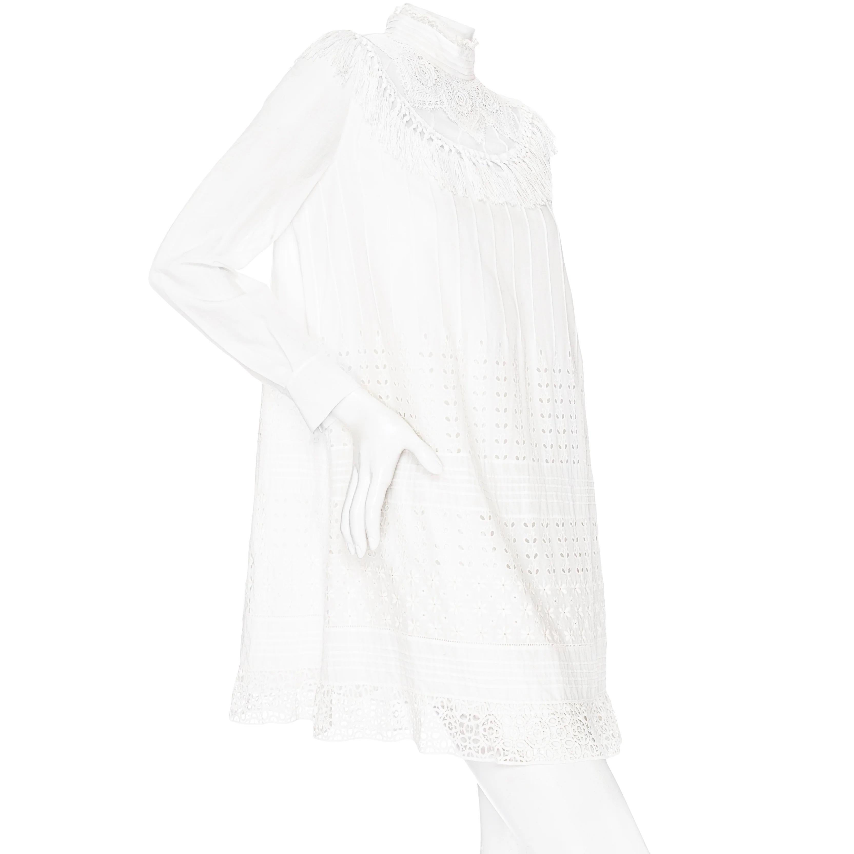 Christian Dior White Cotton Broderie Anglaise High Neck Shift Dress 

White
Broderie anglaise design
Lace-trim high neck collar
Tasseled fringe
Long sleeve
Shift silhouette
Short mini length
Pullover
Lined
Made in France
100% cotton
Great preowned
