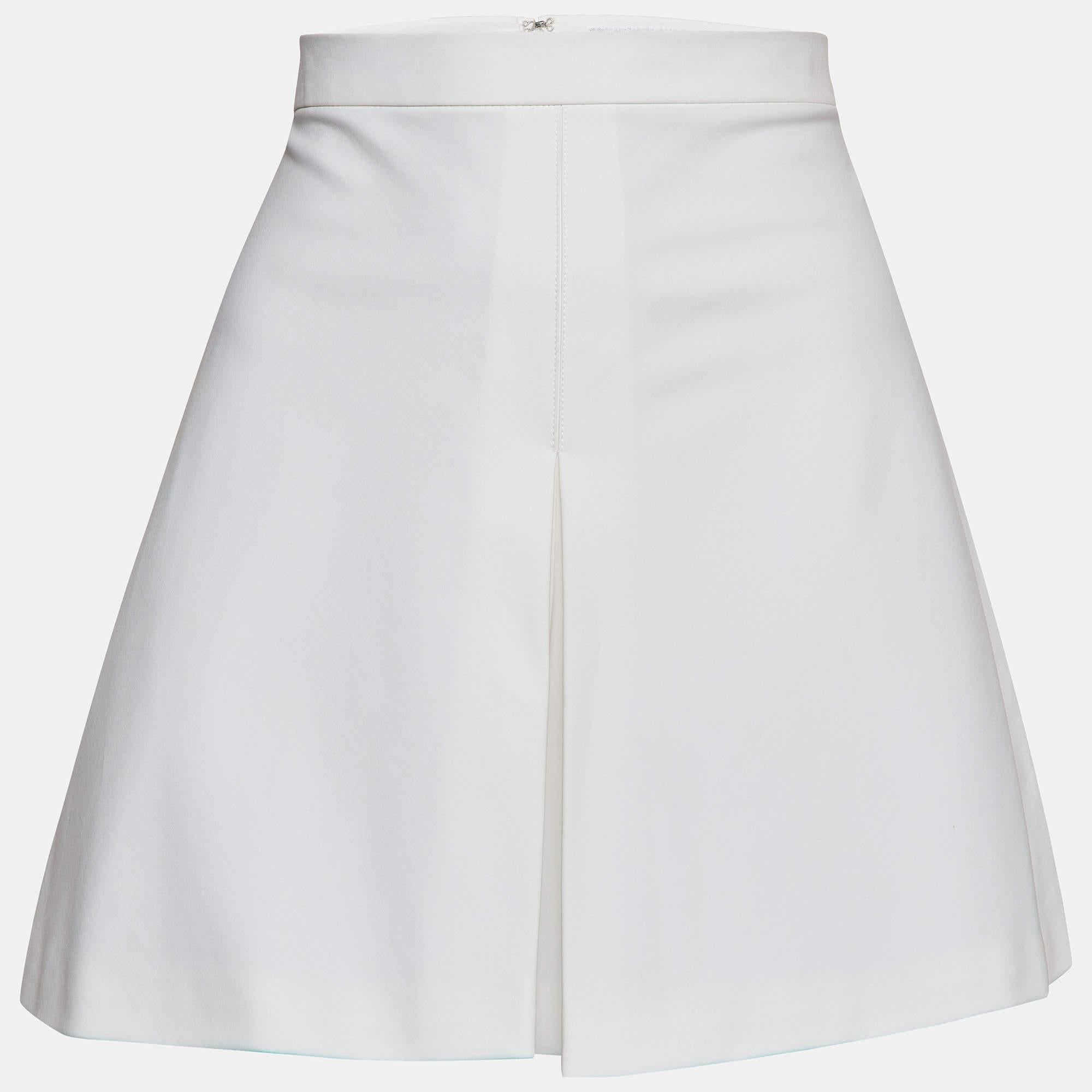 Crafted with precision and finesse, the Christian Dior skorts exude timeless charm. Merging the femininity of skirts with the practicality of shorts, these skorts boast delicate pleats that cascade gracefully. Their crisp white hue adds a refreshing