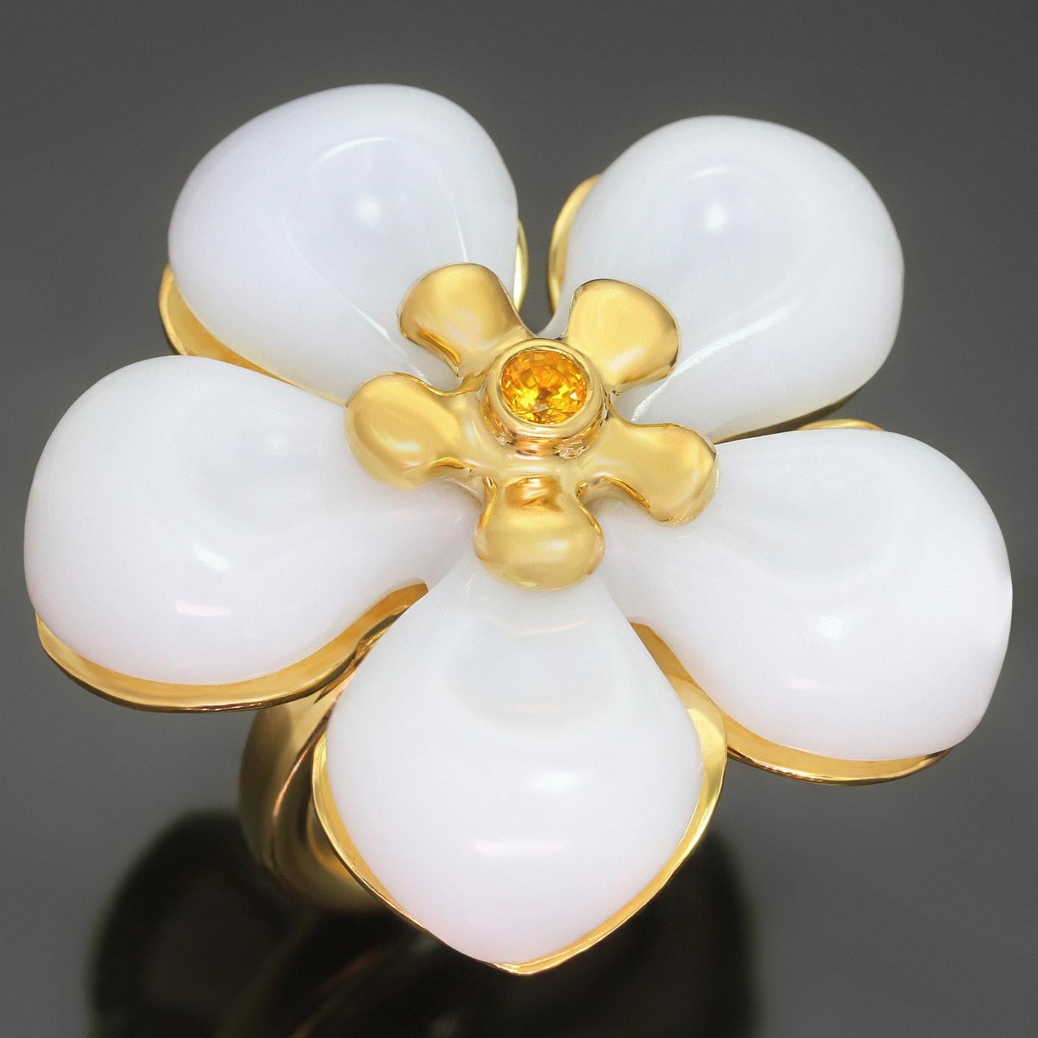 This gorgeous Christian Dior ring features a chic flower design crafted in 18k yellow gold and set with 5 white jade petals and a faceted yellow sapphire in the center. Made in France circa 2010s. Measurements: 1.61