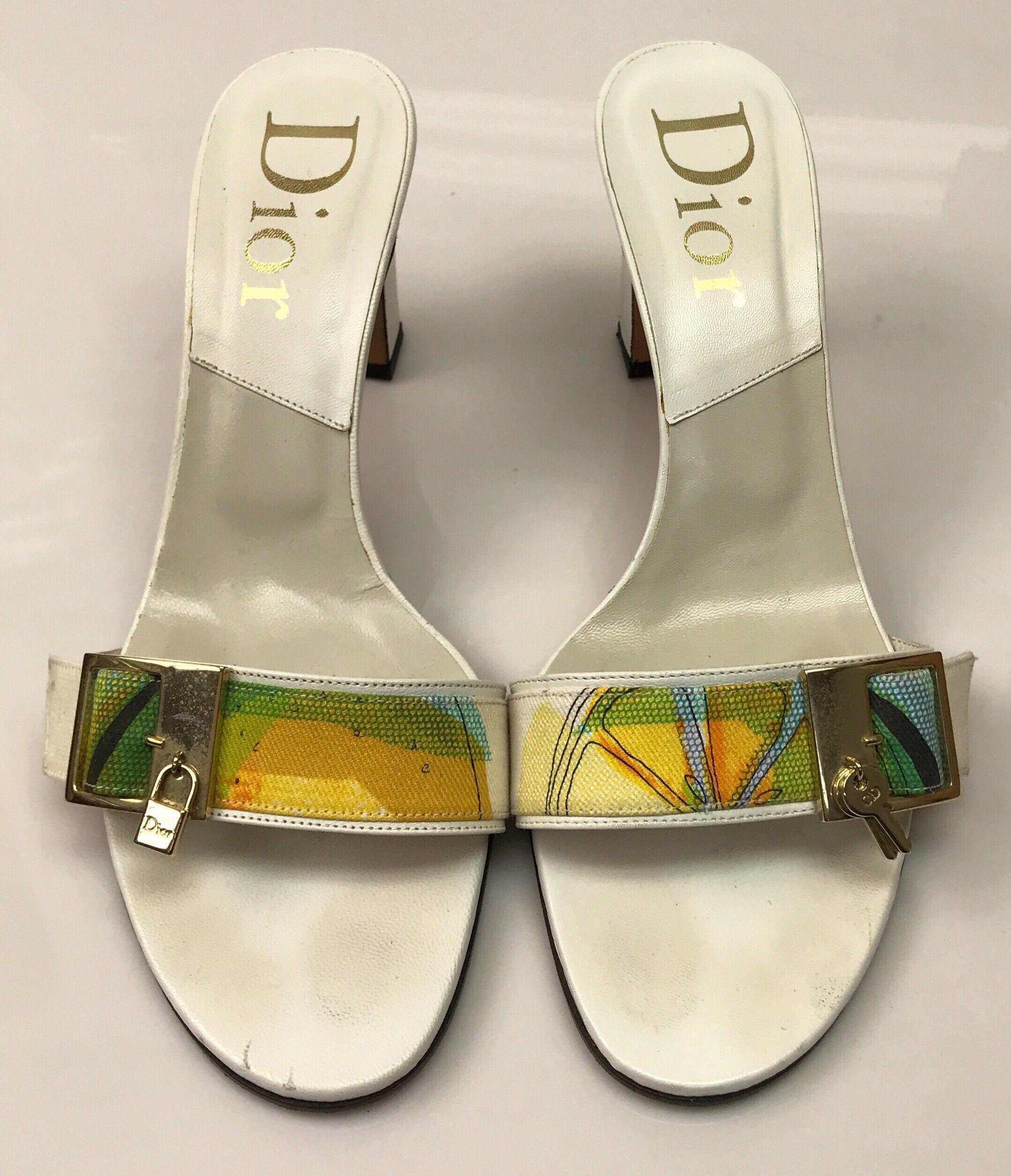 Christian Dior White Leather Heels w/ Front Lock Detail - 39. These beautiful Christian Dior heels are in great condition. They show minor wear consistent with use, shown in pictures. They are made of soft white leather and have a block heel. They