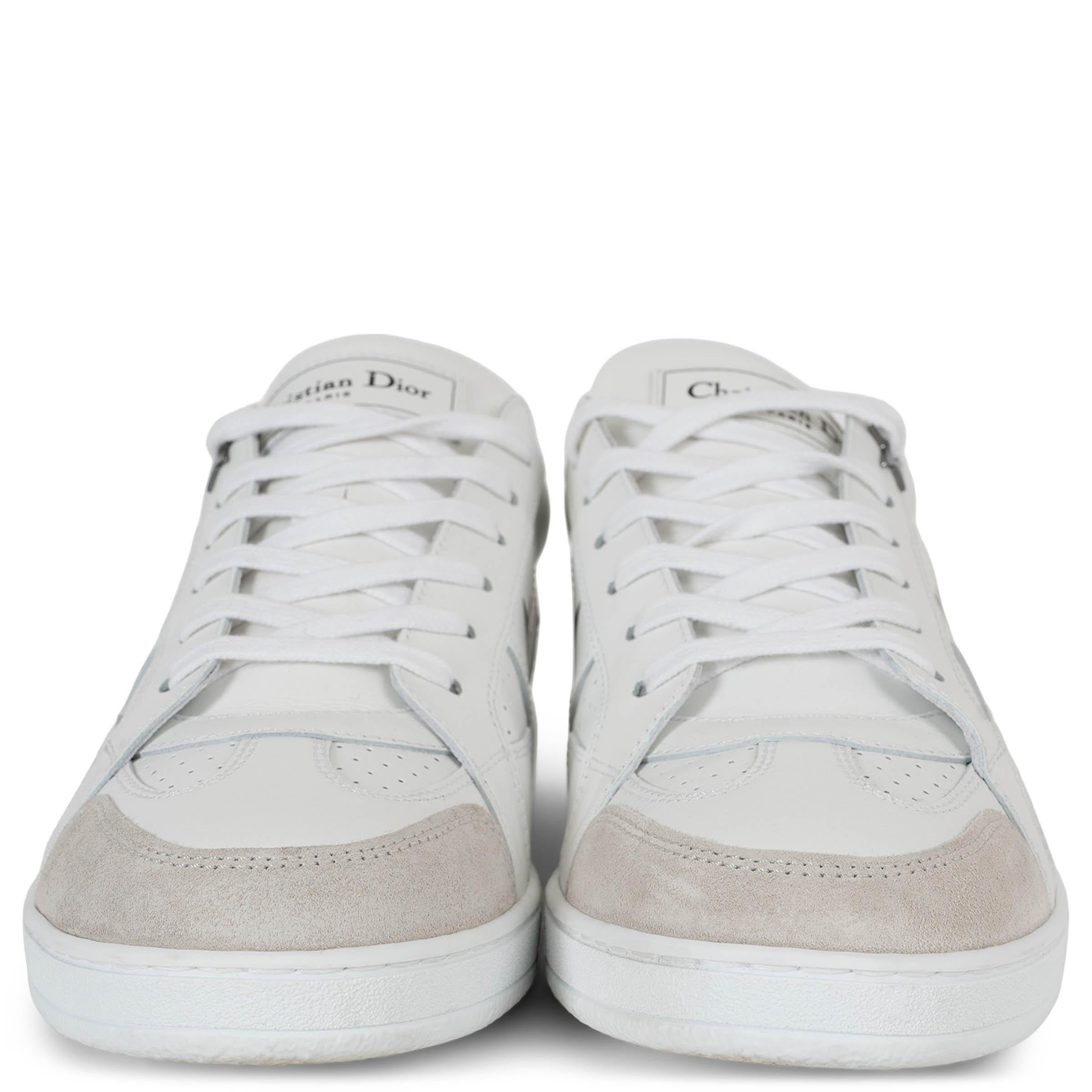 This 100% authentic Christian Dior Star low-top sneakers in white leather offer a refined blend of sporty elegance and signature detailing. Featuring perforated panels for breathability and cream suede trims for a subtle contrast, they are designed