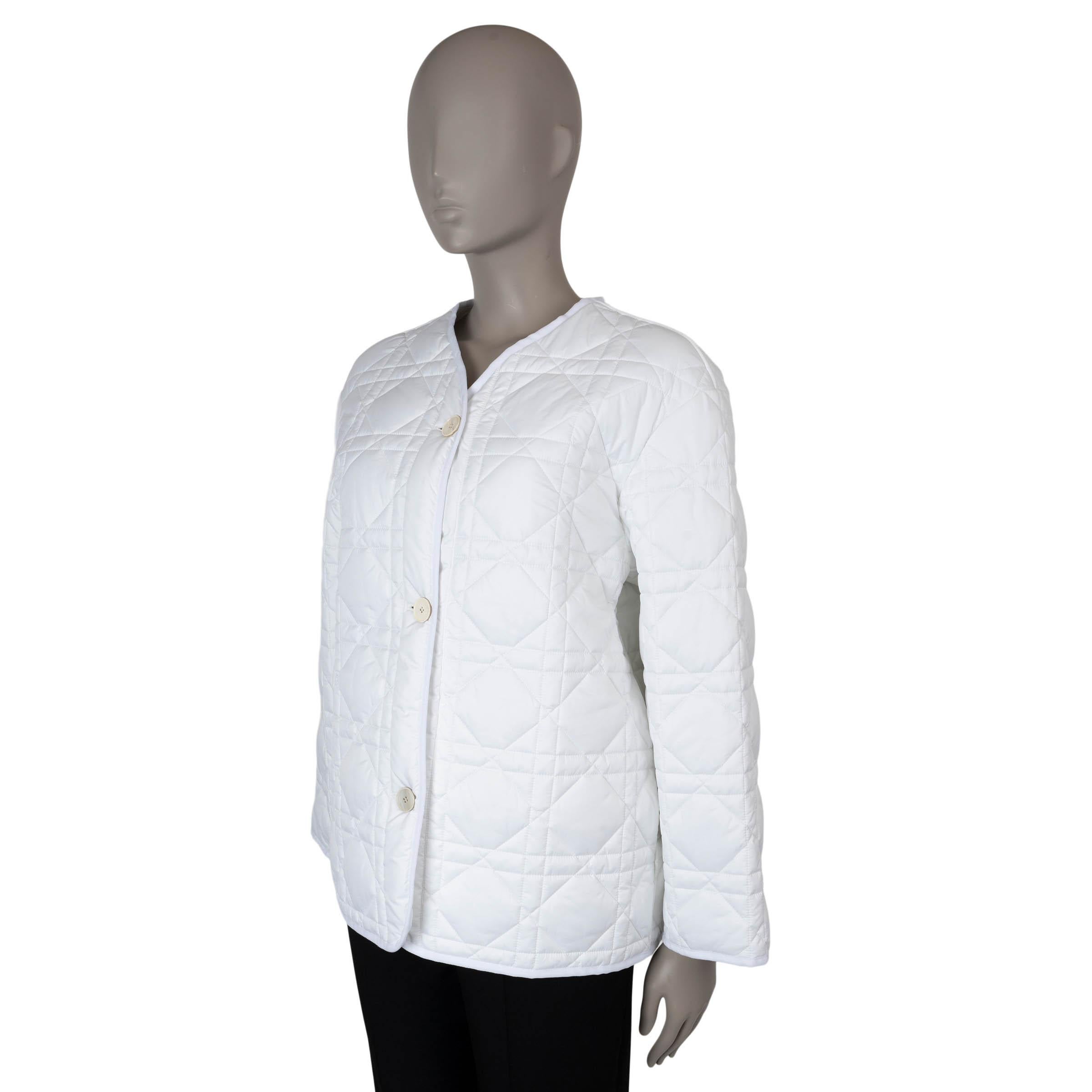 This 100% authentic Christian Dior oversized peacoat is crafted from white macrocannage quilted ultralightweight technical taffeta polyester, with polyester padding for added comfort. It features a relaxed silhouette, a V neckline, and two sleek