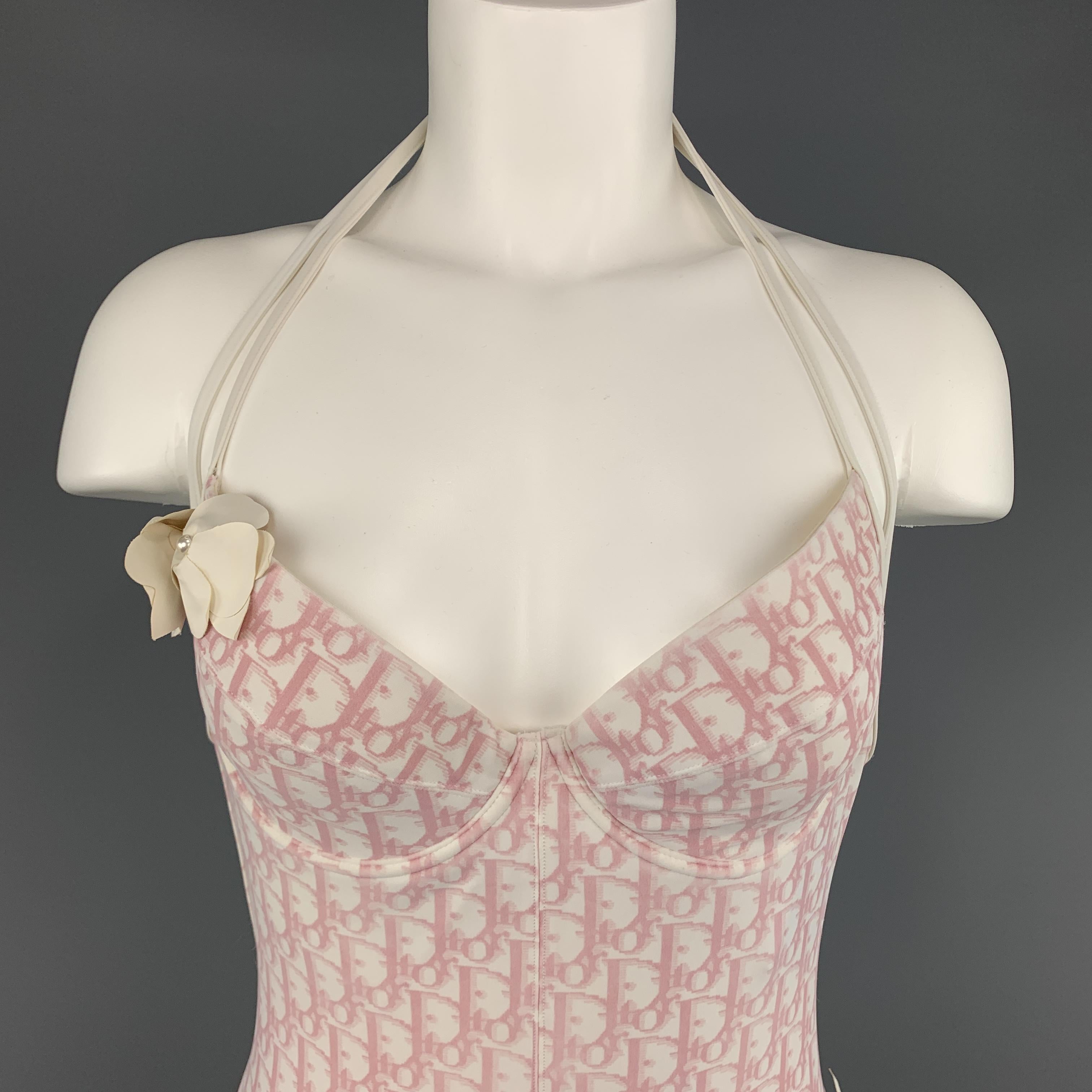 Archive CHRISTIAN DIOR by JOHN GALLIANO swimsuit bodysuit comes in classic pink and white Diorissimo monogram stretch nylon with a low back, halter top, and rhinestone and floral appliques. Missing faux pearl on flower at hip. As-is. Made in