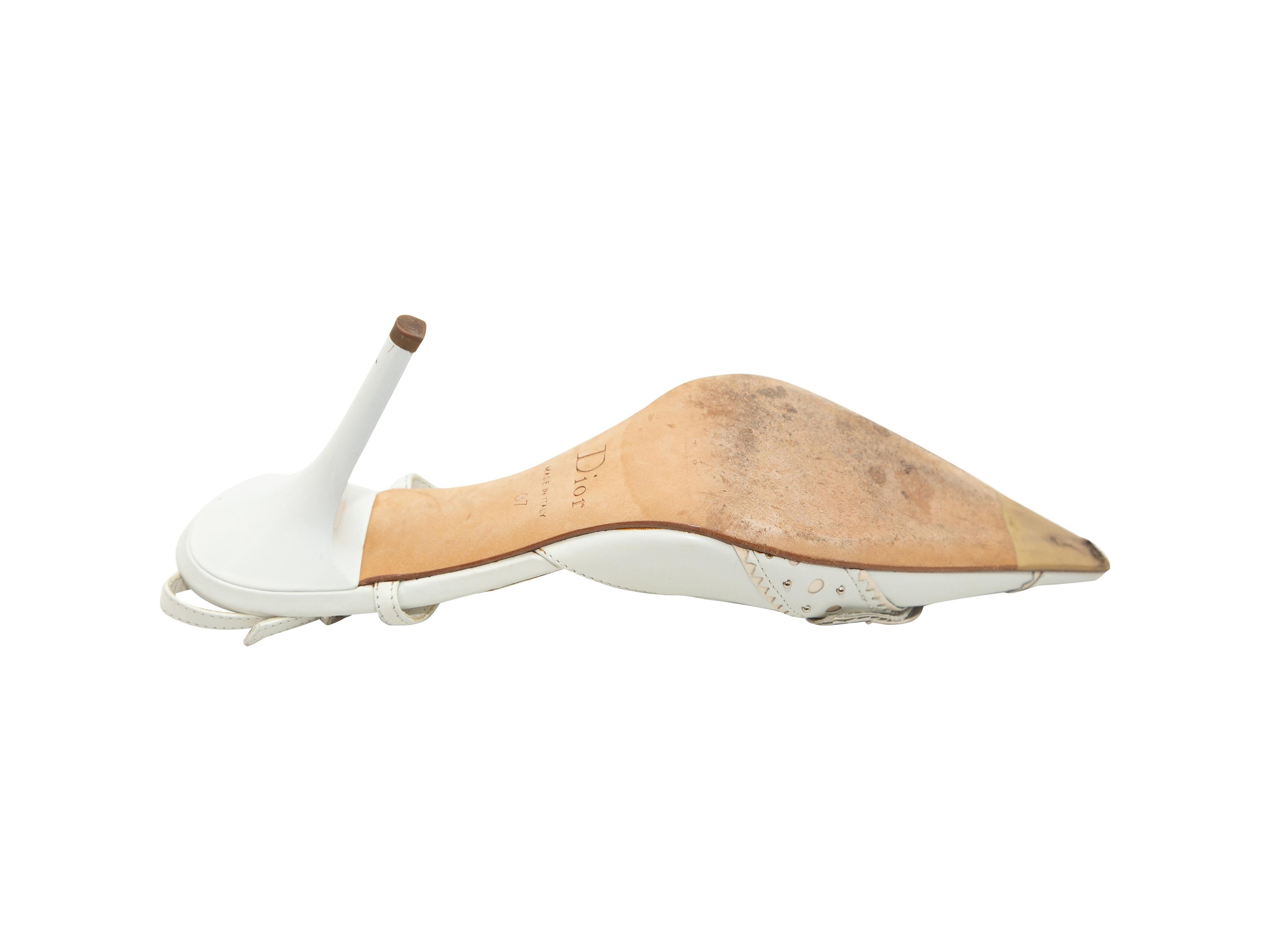 Product details: White leather pointed-toe slingbacks by Christian Dior. Silver-tone logo buckle adornments at tops. Buckle closures at slingback straps. Designer size 37. 4