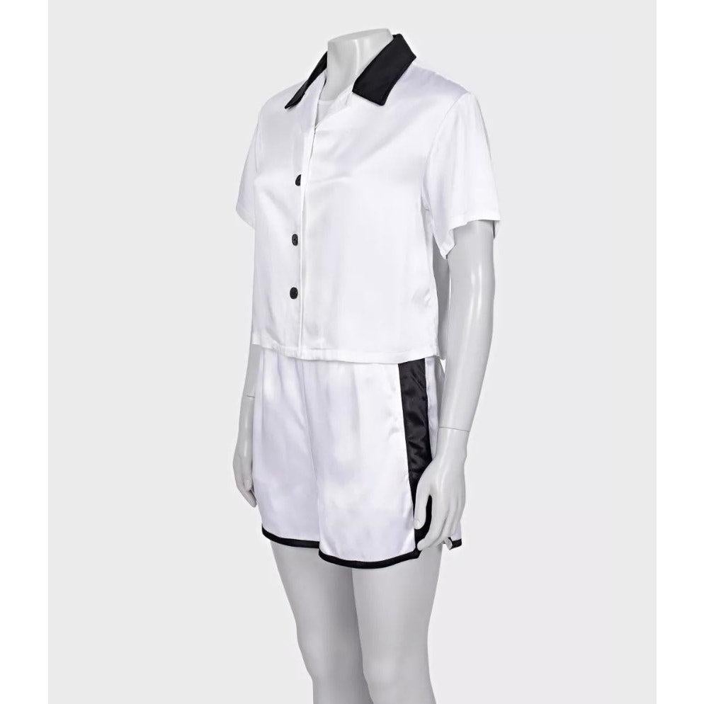 Zeitloser zweiteiliger Anzug von Christian Dior aus frischer weißer Viskose. Akzentuiert durch schicke schwarze Kontrastpaneele. Größe XS, entsprechend der Markengröße von Dior. Setzen Sie ein Zeichen mit diesem kultigen Designerstück!