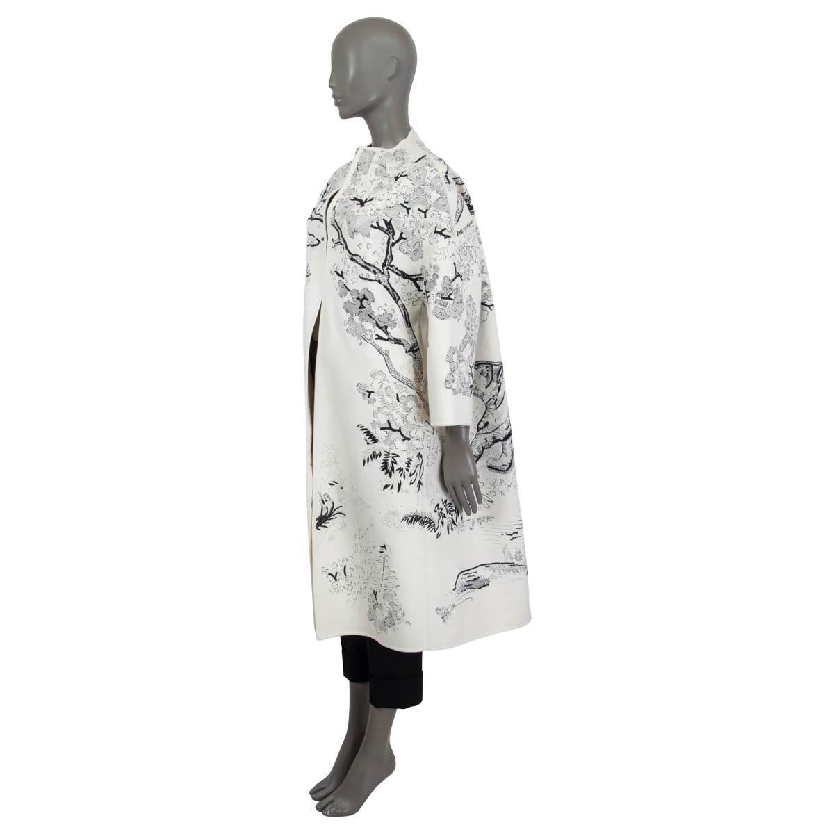 100% authentic Christian Dior embroidered coat in off-white and black wool (80%), rabbit hair (15%), cashmere (2%), nylon (2%) and elastane (1%). Features 3/4 sleeves and two slit pockets on the side. Opens with two hooks on the front. Unlined. Has