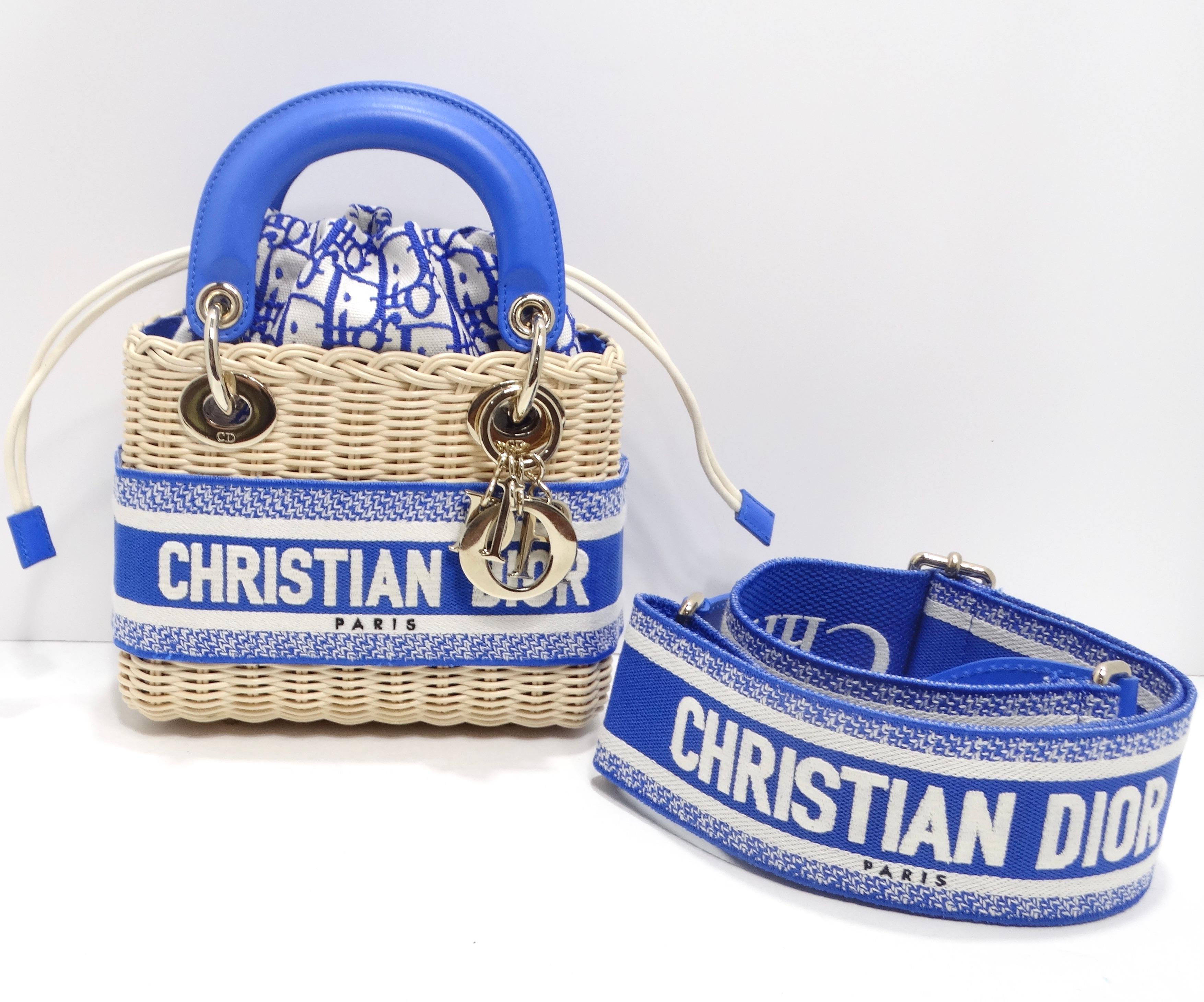 Introducing the Christian Dior Wicker Oblique Mini Lady Dior Bag in Florescent Blue – a small yet stunning accessory that effortlessly blends sophistication with a touch of playfulness. This miniature masterpiece is meticulously crafted from Dior