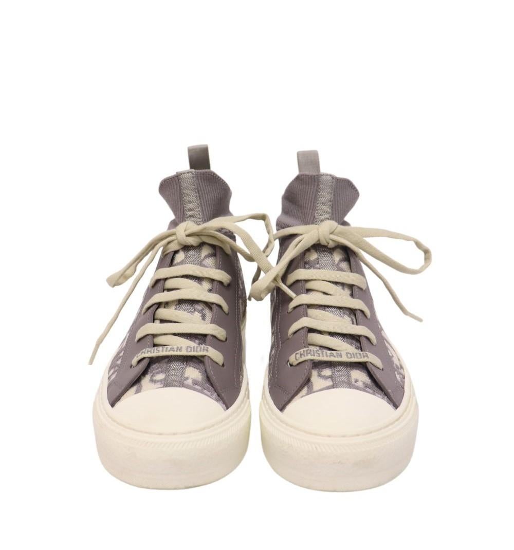 Christian Dior Women's Walk'N'Dior Oblique Technical Sneakers, Features round toe shape, low top, rubber sole and lace up style.

Material: Mesh and Calfskin
Size: EU 36.5
Overall Condition: Good
Interior Condition: Signs of use
Exterior Condition: