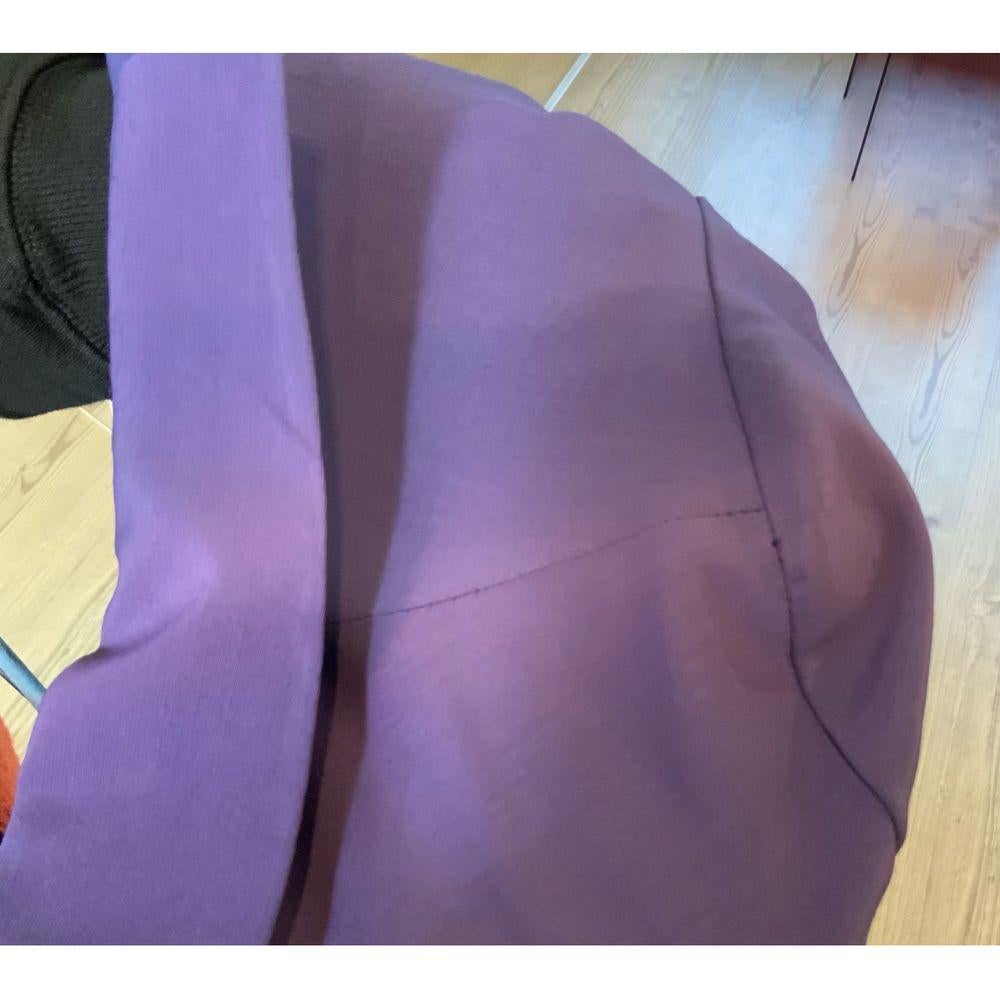 Christian Dior Wool Mid-Length Dress in Purple

Christian Dior coordonnés Purple dress, tuxedo style with side buttons. In lined wool, indicated size 42. 
Shoulders 42 cm, sleeves 60 cm, breasts 46 cm, waist 38 cm and 100 cm long. New with tag, only
