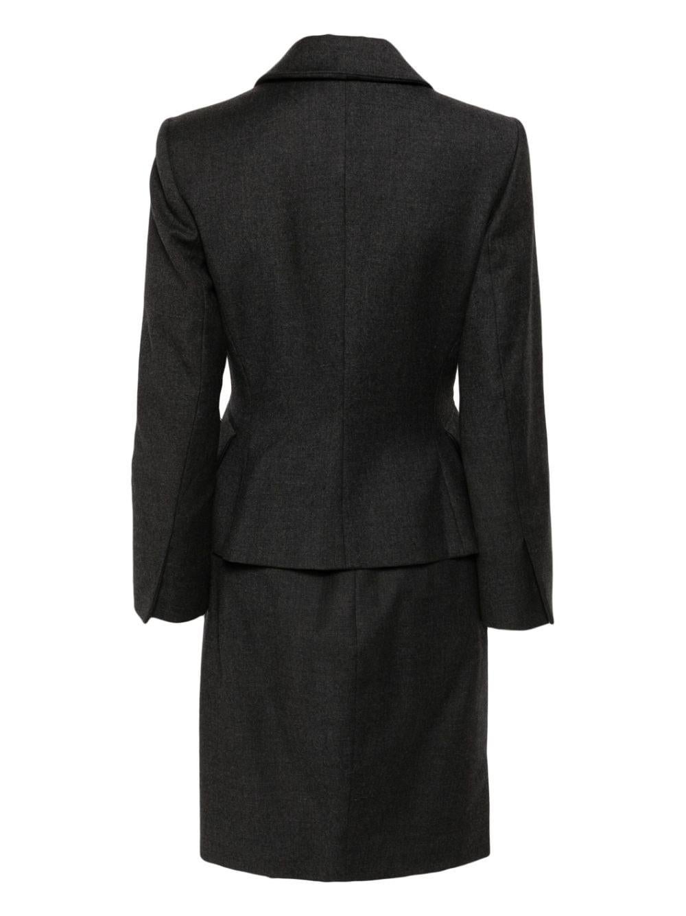 Christian Dior 1990s wool skirt suit.
circa:1990s
Silk 56%, Polyester 22%, Polyamide 13%, Acrylique 9%
In good vintage condition. Made in France.
Estimated size 38fr/US6 /UK10
We guarantee you will receive this gorgeous item as described and shown