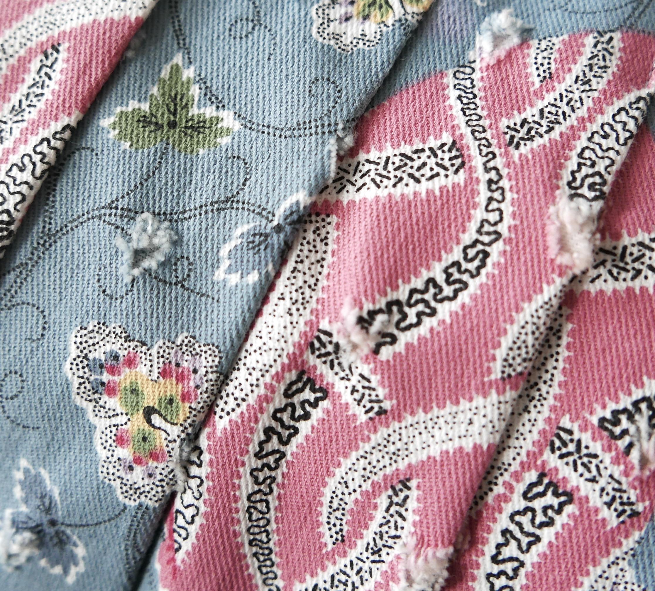 Absolutely incredible, unworn vintage Christian Dior skirt from John Galliano's Spring 2003 collection. Made from mid weight cotton and lycra with hand cut detailing and a pale blue and pink ribbon and flower print. it has a flared, pleated cut with