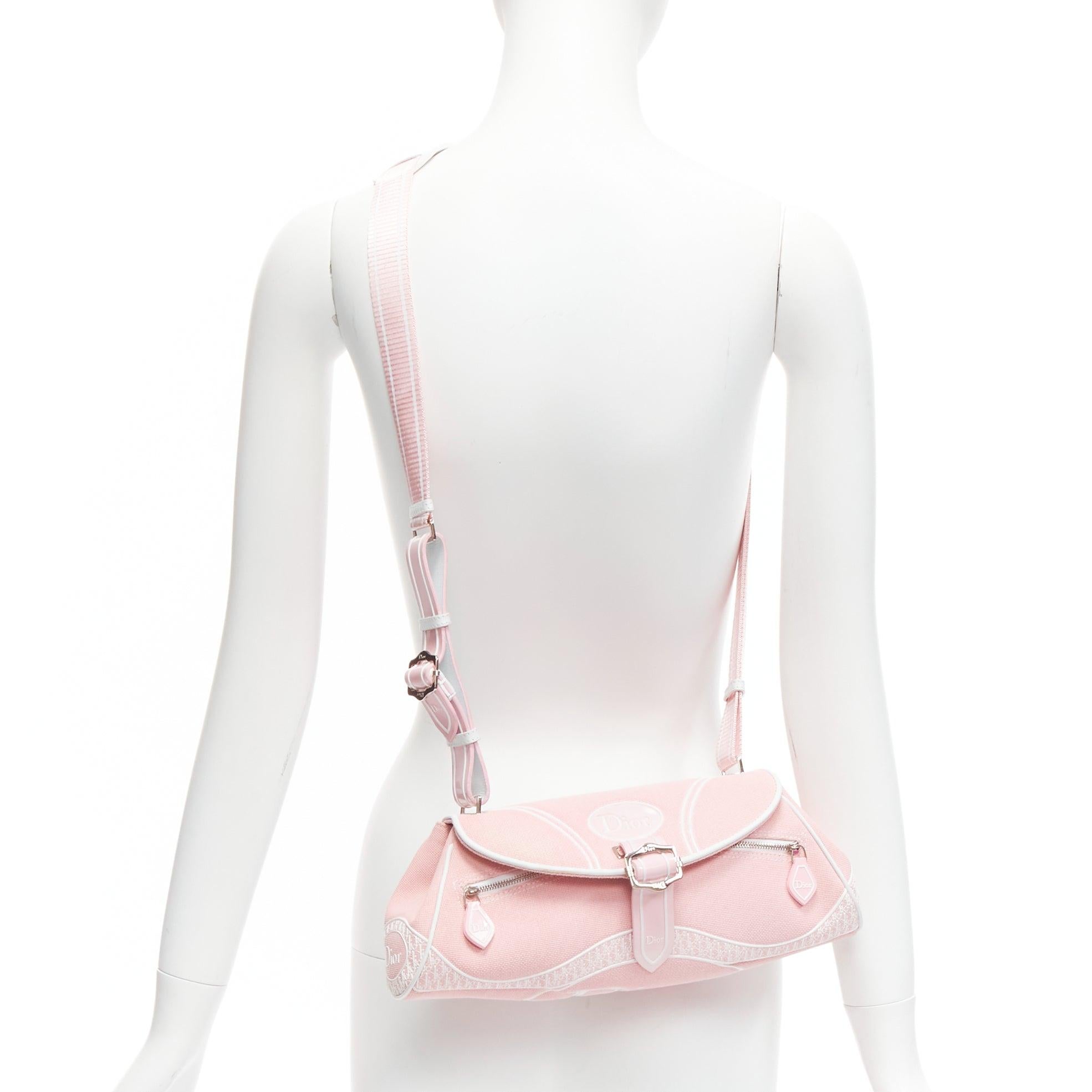 CHRISTIAN DIOR Y2K pink logo monogram trotter canvas shoulder bag
Reference: TGAS/D00563
Brand: Christian Dior
Designer: John Galliano
Material: Canvas, Leather, Rubber
Color: Pink
Pattern: Monogram
Closure: Snap Buttons
Lining: Pink Fabric
Extra